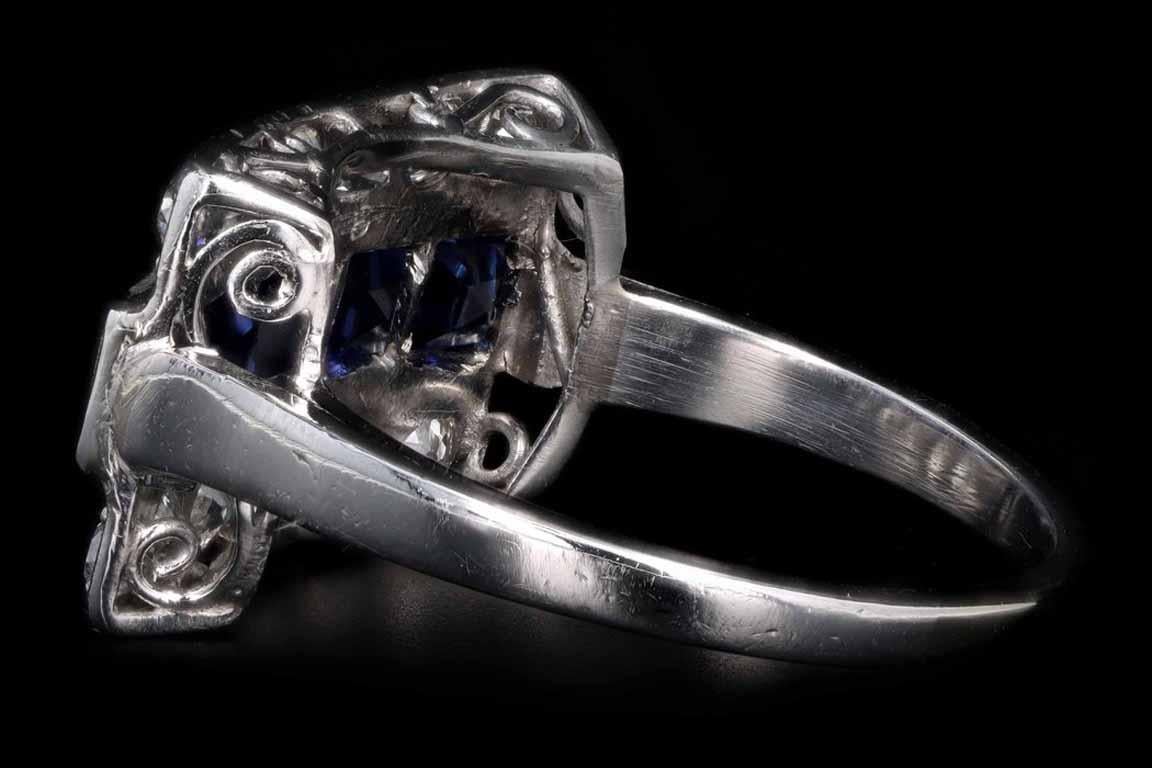 Art deco platinum 1.5 carats in total synthetic sapphire and old european cut diamond ring

Era: Art Deco
Composition: Platinum 
Primary Stone: (5) Synthetic Sapphires
Carat Weight: Approximately 1.5 Carats 
Accent Stone: (12) Old European Cut