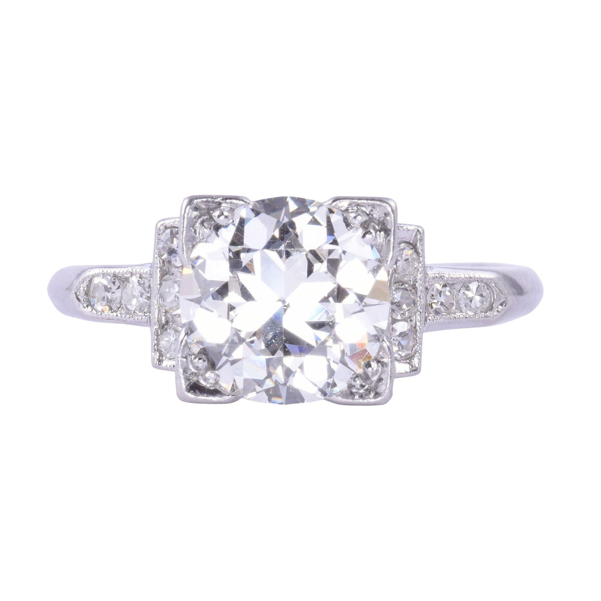 Vintage Art Deco platinum 1.95 carat center diamond engagement ring, circa 1930. This Art Deco engagement ring is crafted in platinum with milgrain detailing and features an illusion set 1.95 carat old European cut diamond center. This diamond has