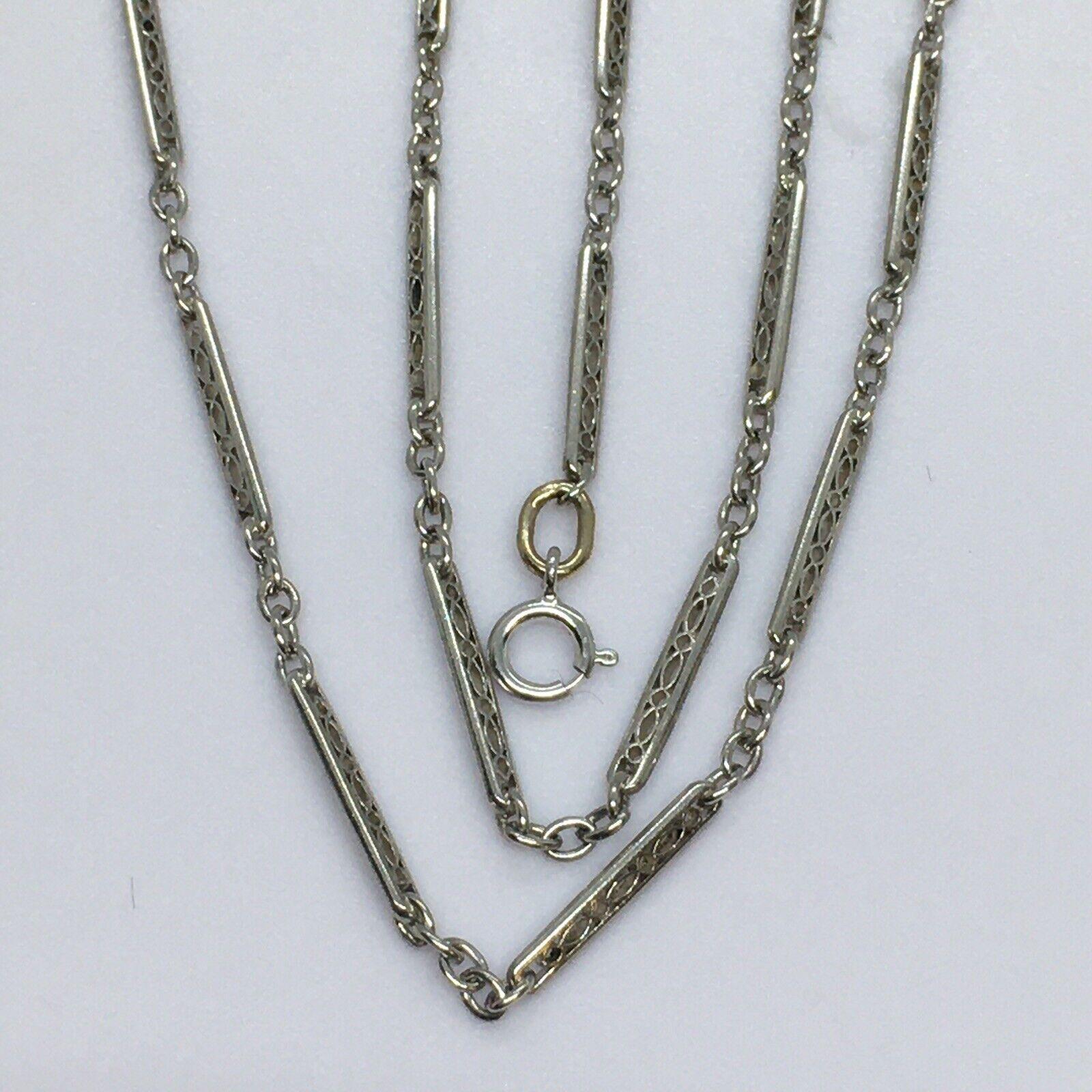 Art Deco Filigree Platinum Pocket Watch Fob Chain

Length 20.5 Inch
Measurements 14 mm filigree bars in 2 mm wide, 2 mm smaller links
Metal Platinum, tested at 90%
Weight 8 Gram
Condition Gently used, No sign of repairs, see pictures
Art Deco period