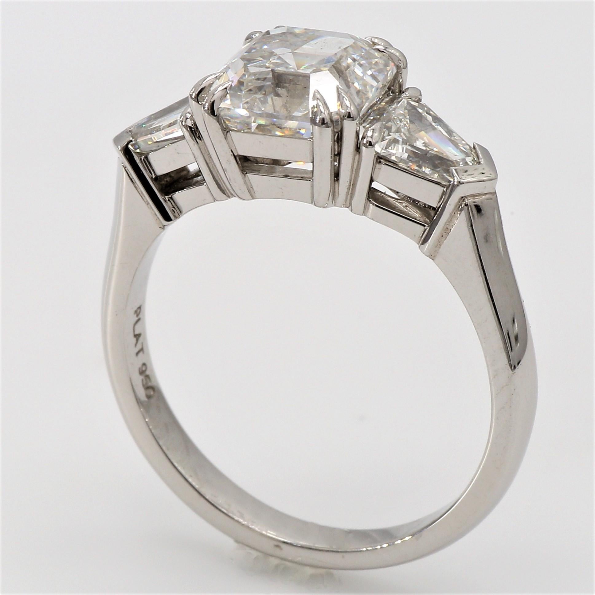 Handcrafted Platinum Engagement Ring,
Asscher Cut White Diamond 2.59ct  H color, SI2 clarity flanked by 2 Trapezoid Shape White Diamonds totaling 0.75ct G-H Color, VVS2 Clarity.
Double 4 Claw Designer Ring. EGL Certified South African Diamond
Ring