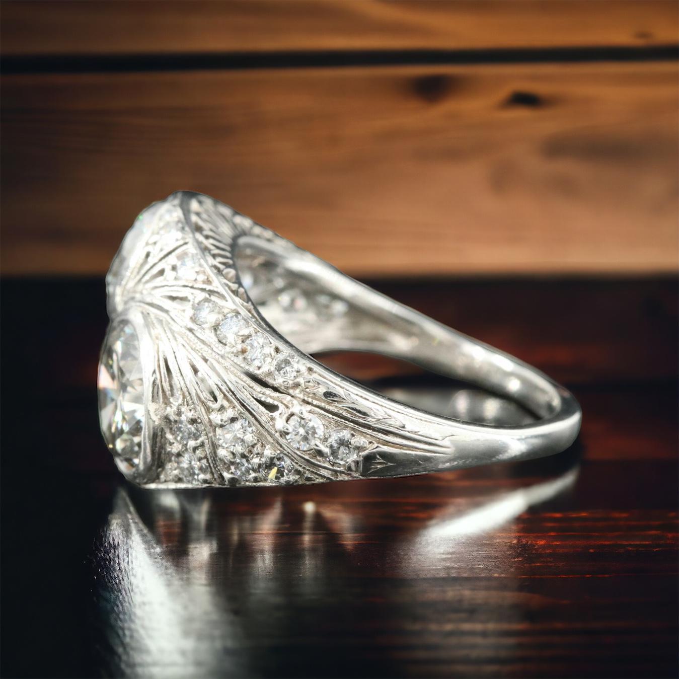 Crafted in the elegant Art Deco style, this platinum ring exudes timeless sophistication. The centerpiece boasts a dazzling 1.59-carat diamond flanked by a resplendent 1.20-carat counterpart, creating a striking contrast. Surrounding these exquisite