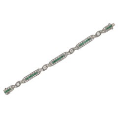Antique Art Deco Platinum, 6 Carat Diamond and Calibré Emerald Bracelet