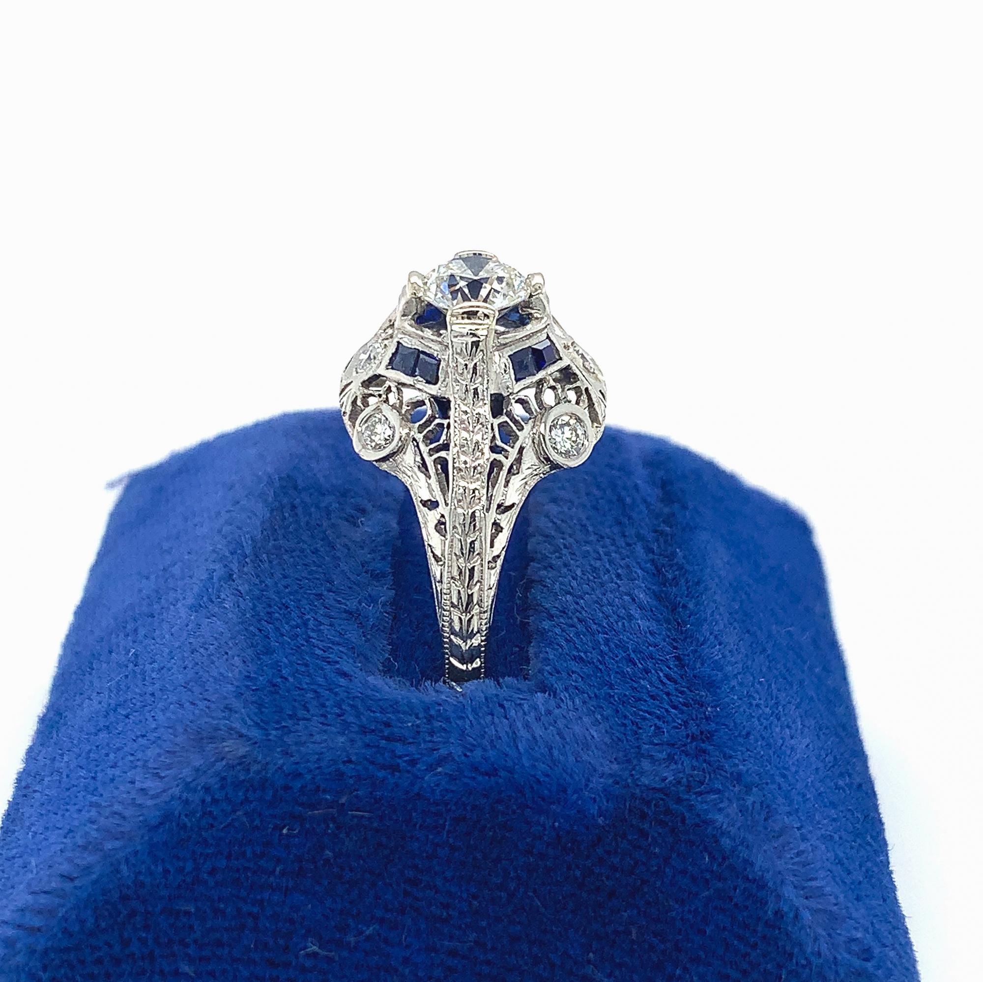 Art Deco platinum filigree ring featuring an European cut diamond weighing .62cts with GIA report. GIA report #2225056999 states H color and I1 clarity. The diamond measures 5.41mm x 5.47mm x 3.29mm. There are 8 specialty caliber French cut