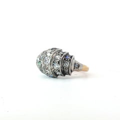 Art Deco Platinum and 18K Gold Old European Cut Diamond Bombé Ring, Circa 1925