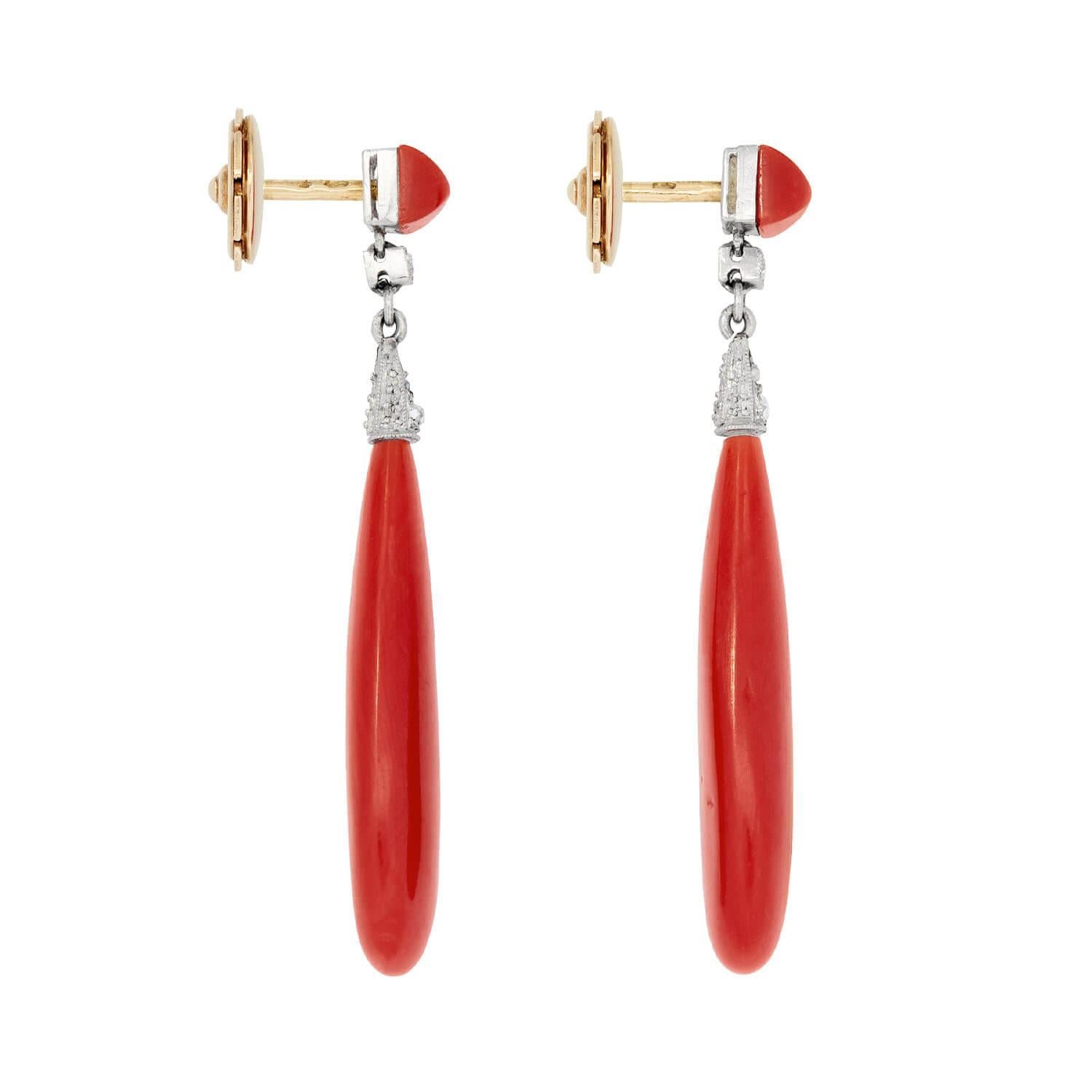 Wonderful coral earrings from the Art Deco (ca1920) era! Each earring begins with a vibrant squared coral cabochon surmount, which is set in a platinum bracket and affixed with new 18k yellow gold posts. Dangling from the coral bead surmount is a