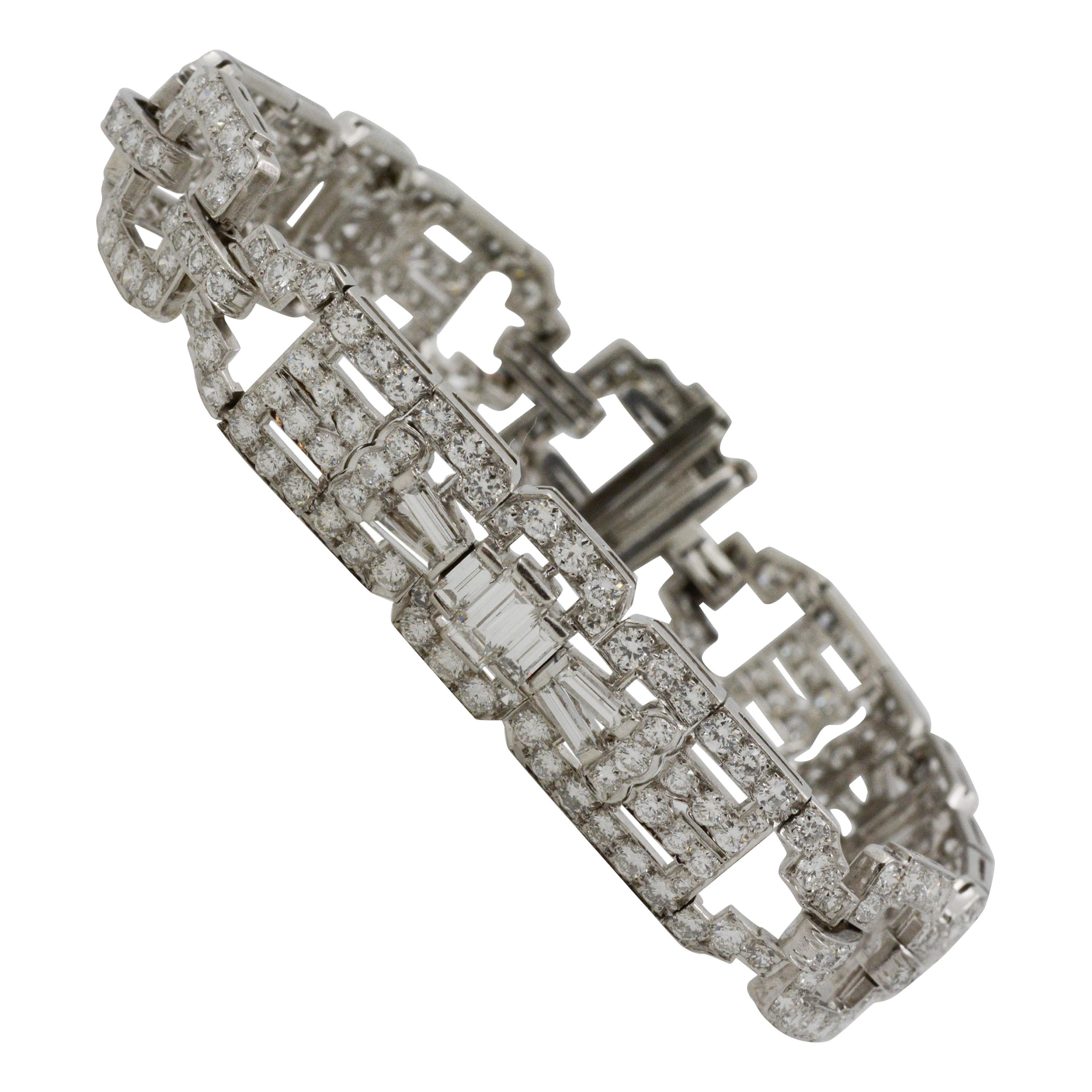 This charming ½” platinum bracelet displays a classic Art Deco design. It features 21 baguette diamonds and 246 round diamond with an approximate combined total weight of 9.36 carats with GH coloring and VS clarity. 