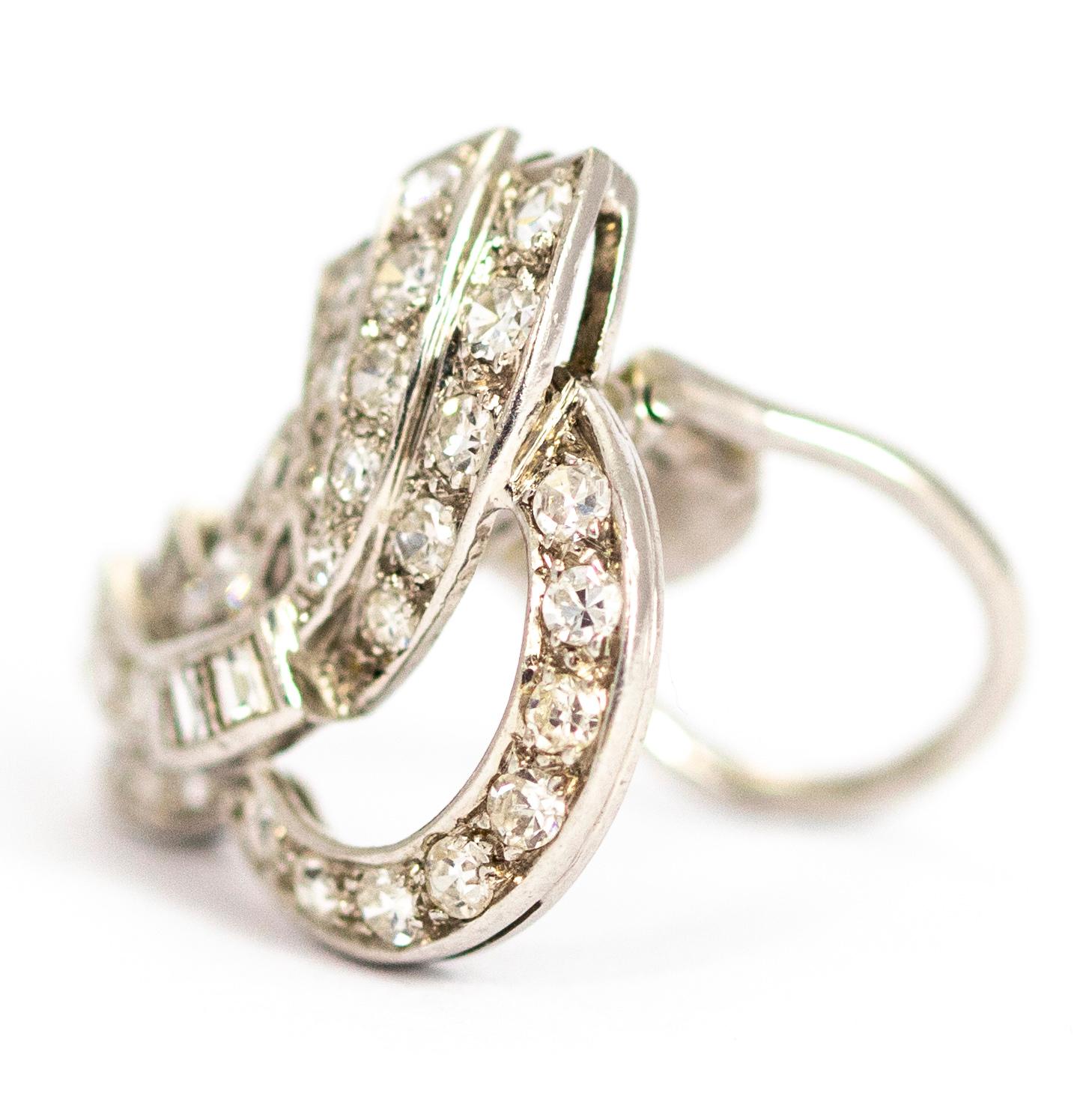An exquisite clip brooch from the Art Deco period, circa 1930. It is beautifully shaped and fully set with 34 stunning princess cut and round cut white diamonds. The total diamond weight in this clip is approximately 78 points. Fully modelled in
