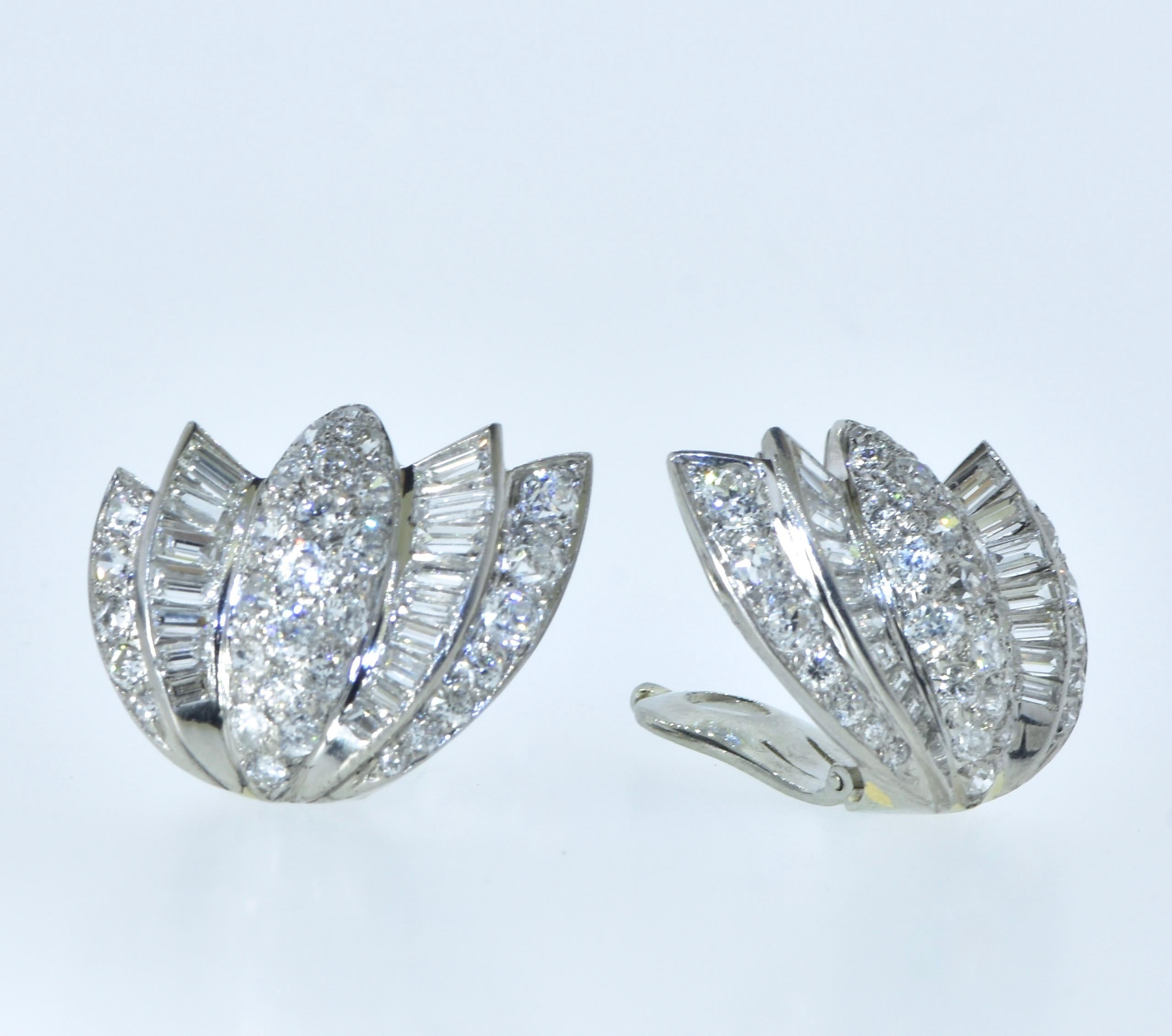 Art Deco Diamond and Platinum and 18K White Gold, French Earrings, circa 1930.  These earrings are comprised of both European cut Diamonds and tapered baguette diamonds.  The stones are all near colorless, H, and very slightly included, VS.  The