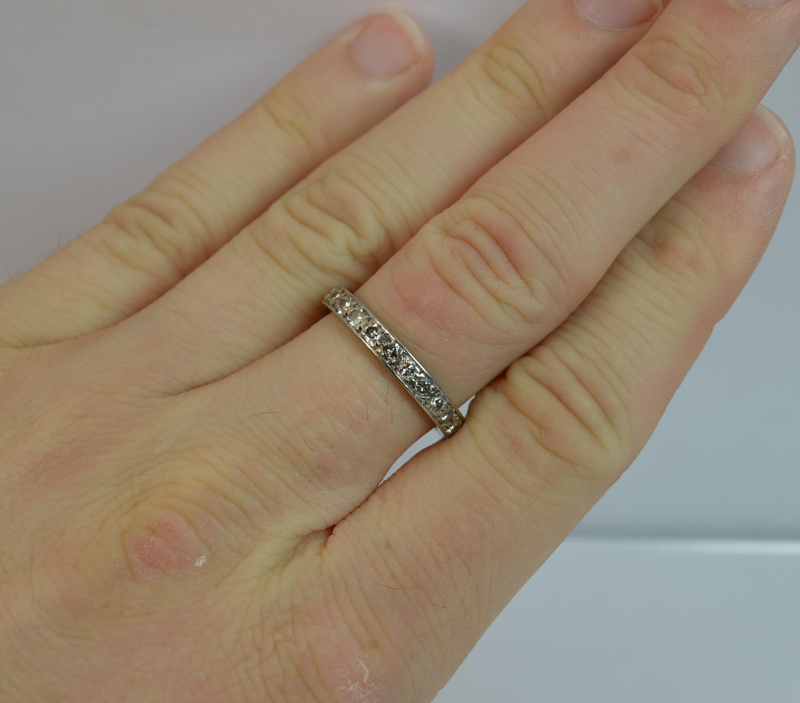
Platinum and Diamond ladies art deco period design full eternity ring.

23 natural round cut diamonds set into band. 3.40m thick throughout, protruding 1.8mm off the finger.

​Circa 1910-20's.

Ideal stack ring.

​Total carat weight of 0.60 carats
