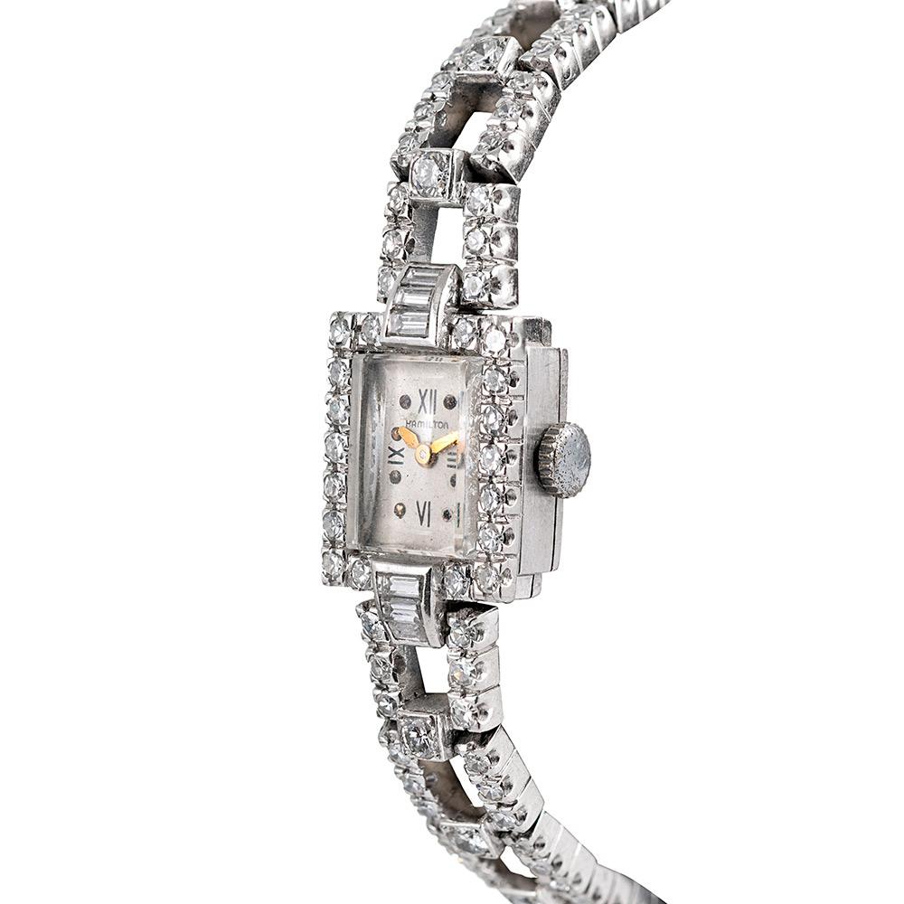 Boasting 5 carats of white diamonds, set in platinum, this beautifully-styled lady’s art deco wristwatch wears like fine jewelry with the added function of time-telling. Note the tapered baguette end pieces and how each brilliant diamond is set in a