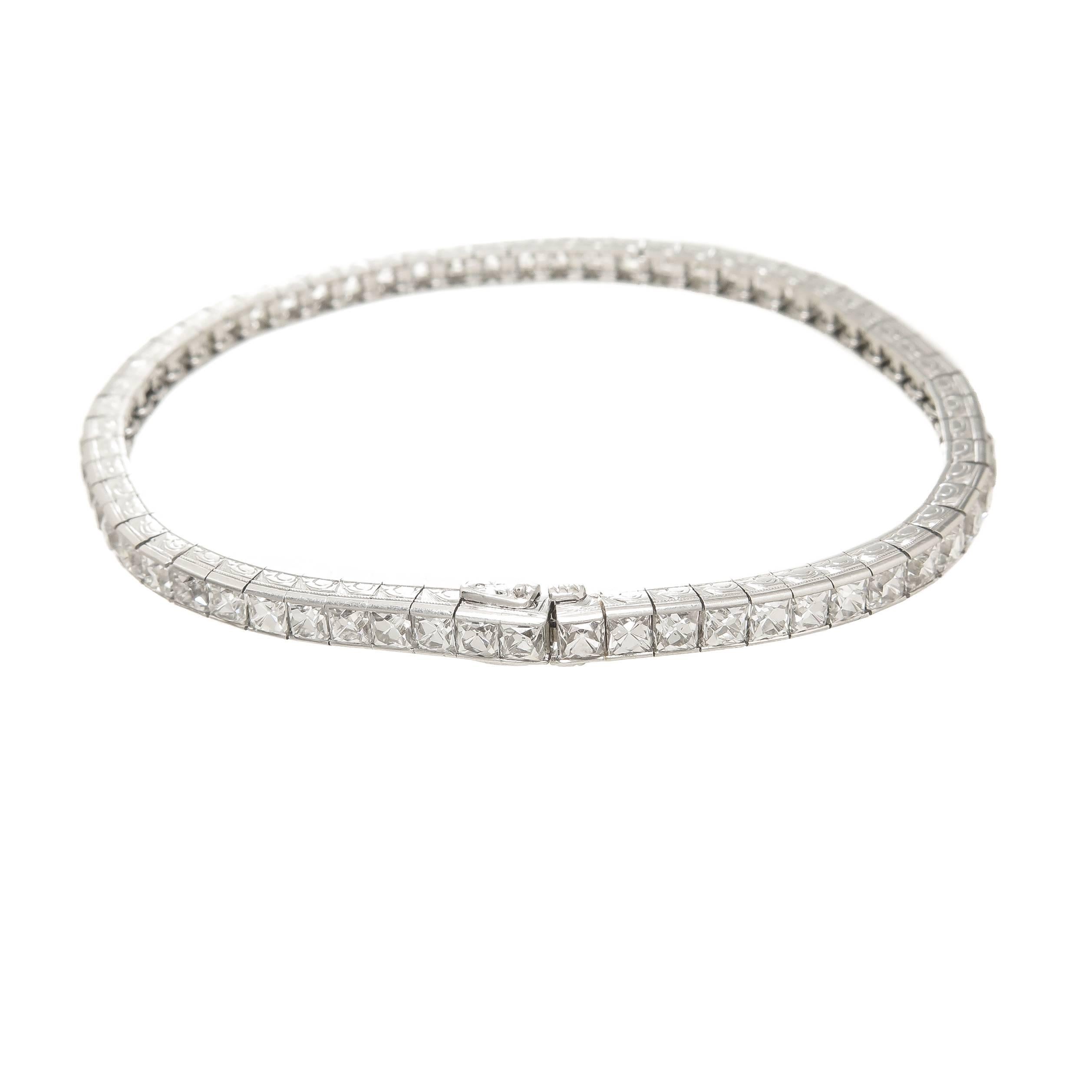 Circa 1920s very scarce to find Platinum line Bracelet with larger French cut Diamonds, this numbered Bracelet measures 7 1/4 inches in length and 3.5 M.M. wide. Set with 62 finely match French Cuts grading each as H in Color and VS to SI in clarity