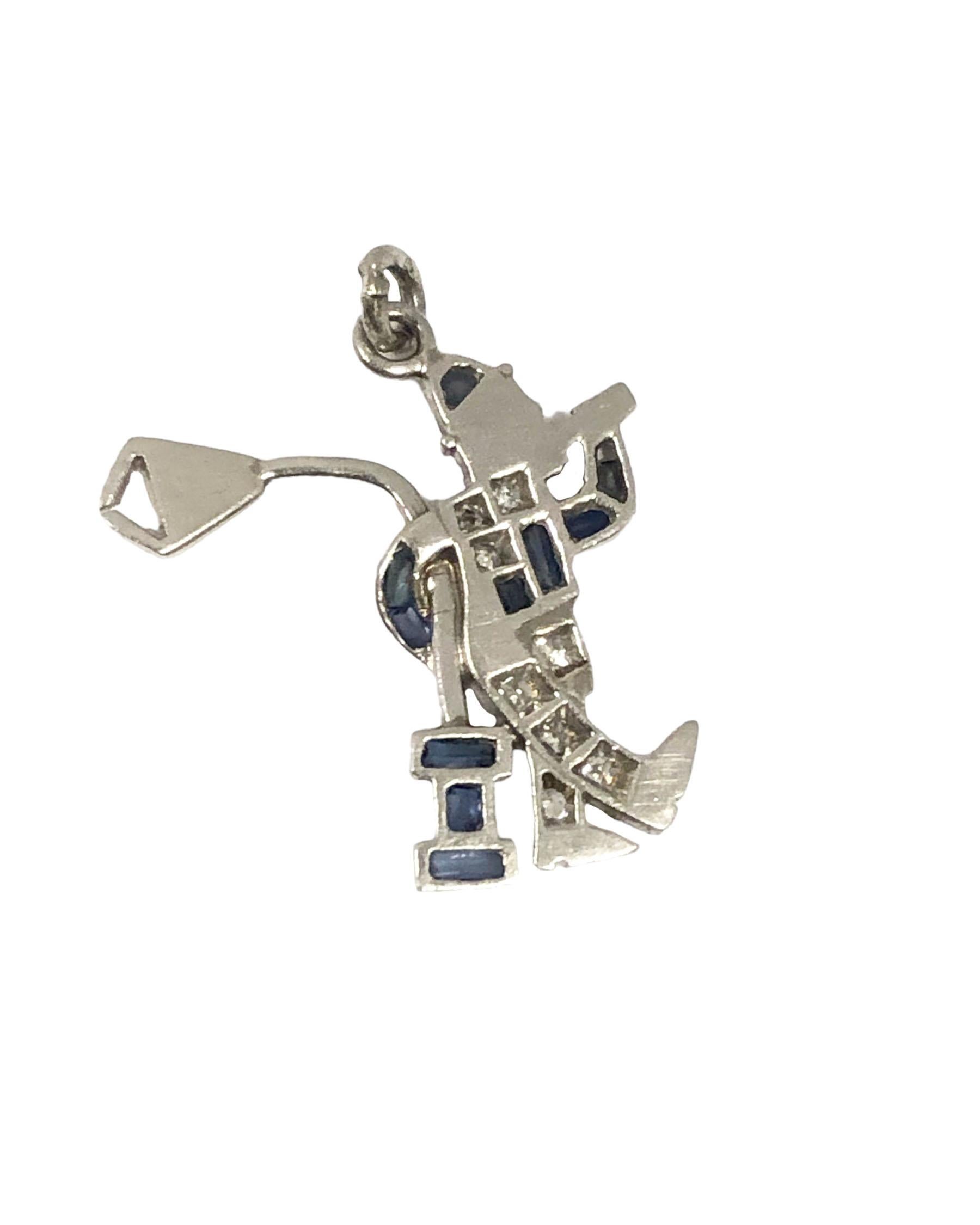 Circa 1930s Art Deco Platinum, Diamond and Sapphire set Guy Drinking at a Lamp Post Charm, measuring 3/4 X 5/8 inch, set with Diamonds and Sapphires. 