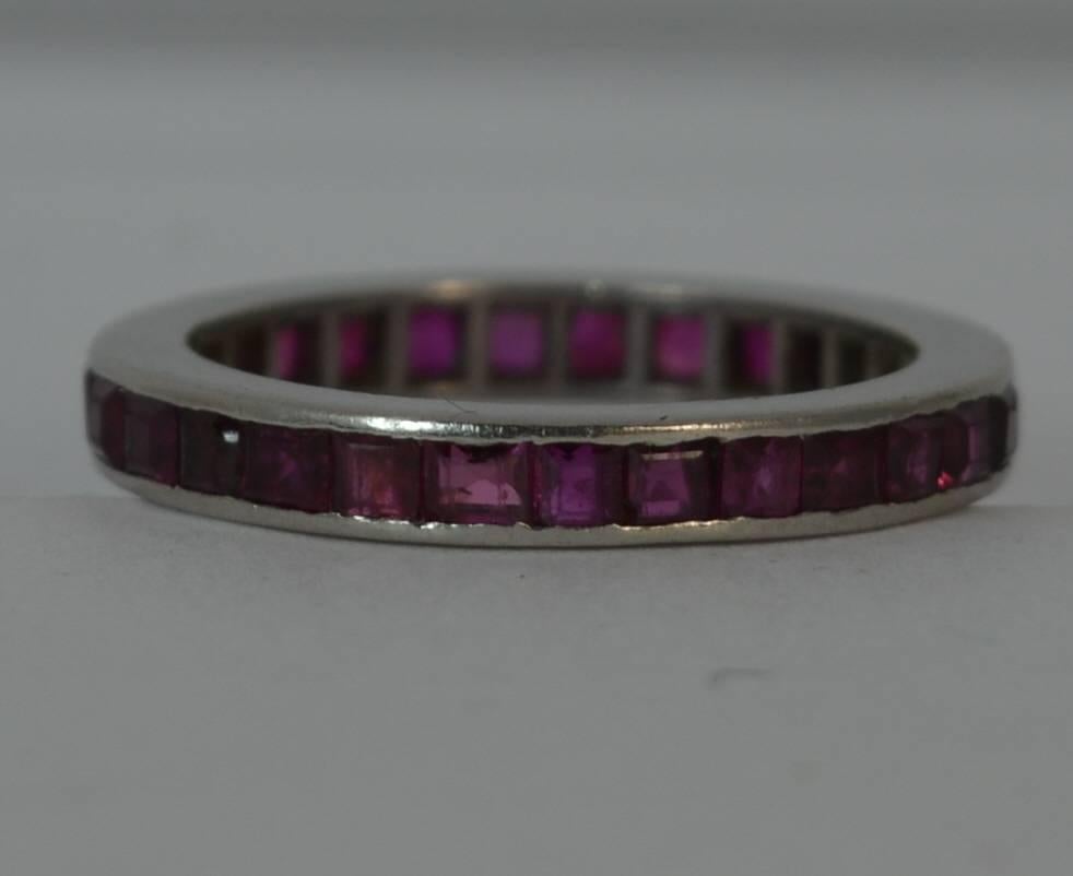 A stunning ladies full eternity ring. Solid platinum ring. Set with princess cut natural ruby stones. 2.6mm thick band throughout, protruding 2.1mm off the finger. True Art Deco period piece, circa 1910/20's.


Condition; Very good for age. Clean