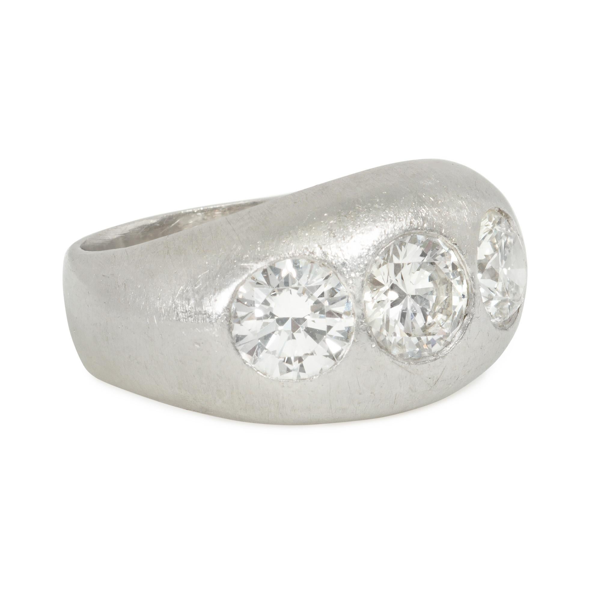 An Art Deco platinum and diamond band-style ring featuring three flush-set old European cut diamonds of approximately 0.70 ct., 0.75 ct. and 0.70 ct., respectively
Face-up vertical measurement approximately 11mm

* Includes Kentshire's letter of