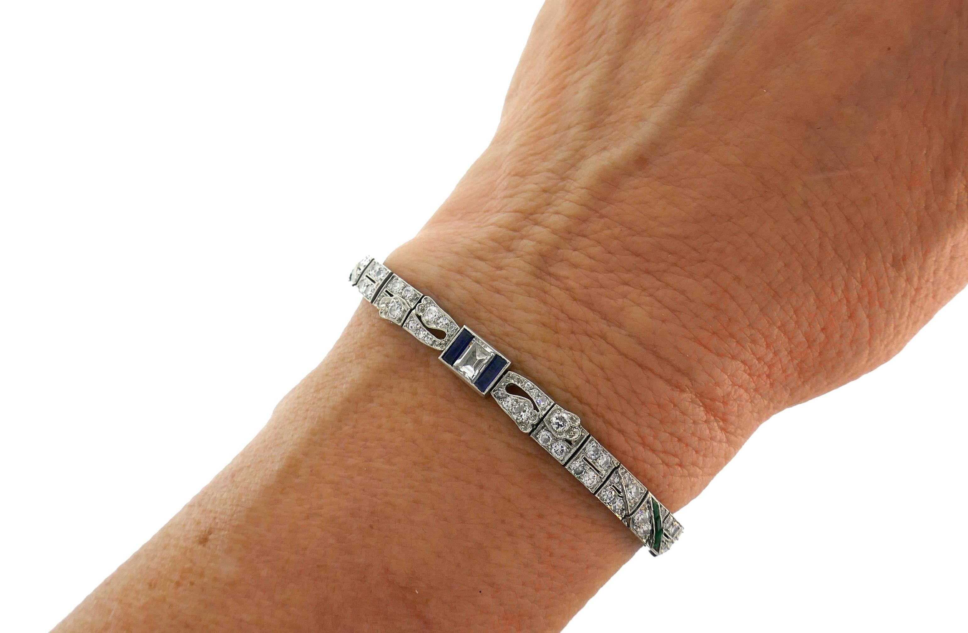 A delicate Art Deco bracelet created in the 1930s.  
The bracelet is made of platinum, step cut (1.50 carats total), Old European and single cut diamonds (4 carats total, I-J color, VS clarity) accented with baguette cut sapphire (0.60 carat total)