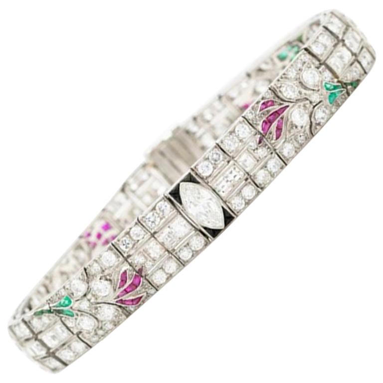 Art Deco Platinum Carre Cut Diamond and Colombian Emerald, Onyx and Ruby