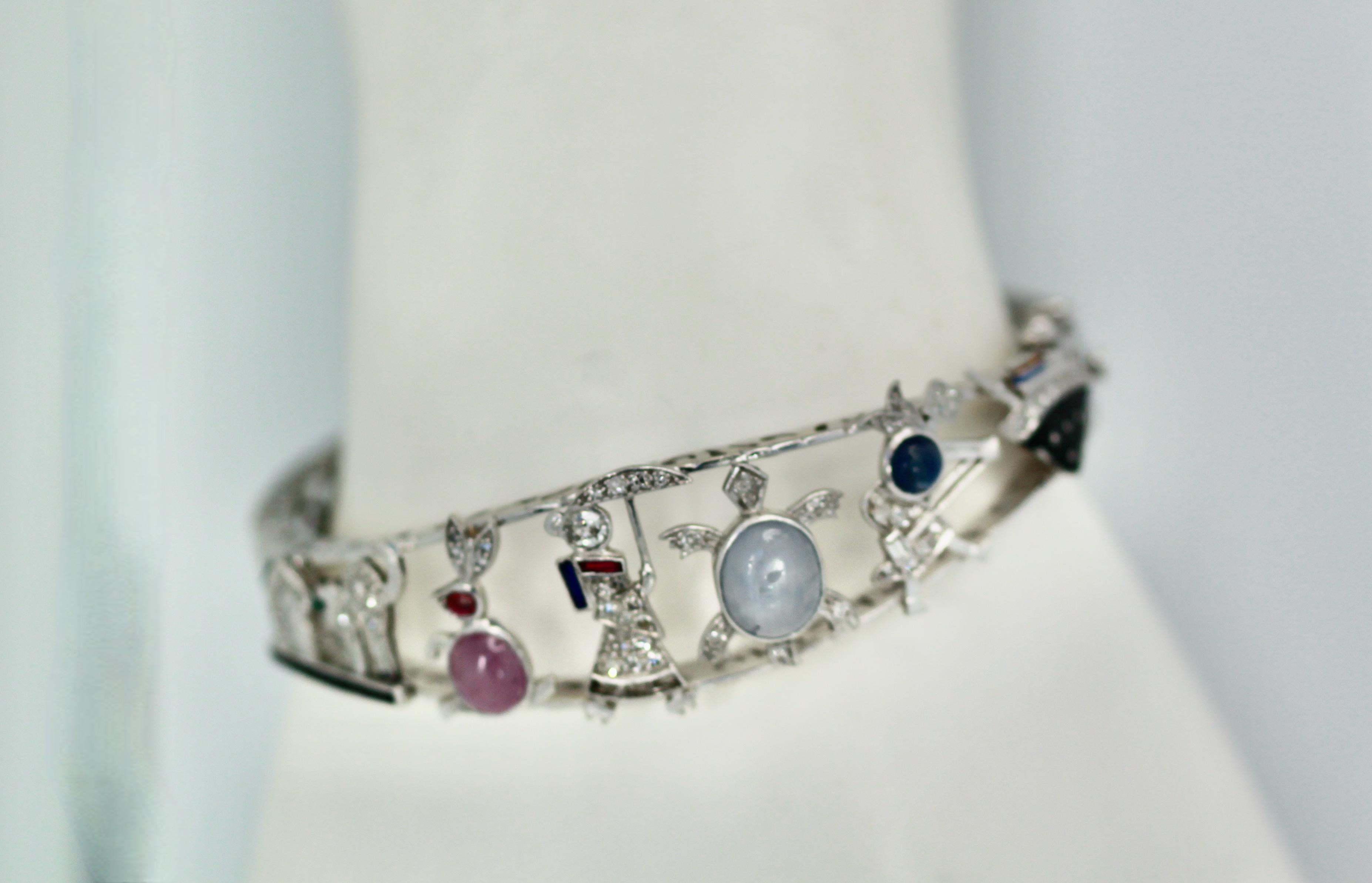 Women's Art Deco Platinum Charms on Bracelet For Sale