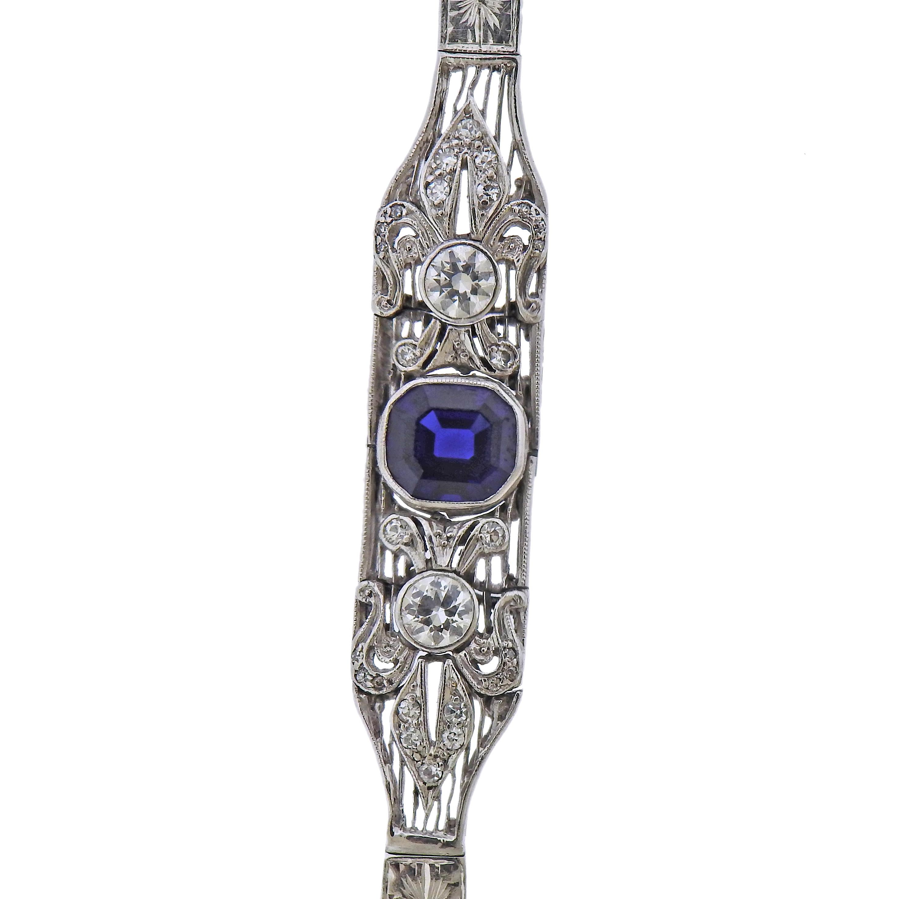 Art Deco delicate bracelet, adorned with a blue sapphire in the center - 7.2mm x 6.4mm , and approx. 0.60ctw in diamonds. Bracelet is 7