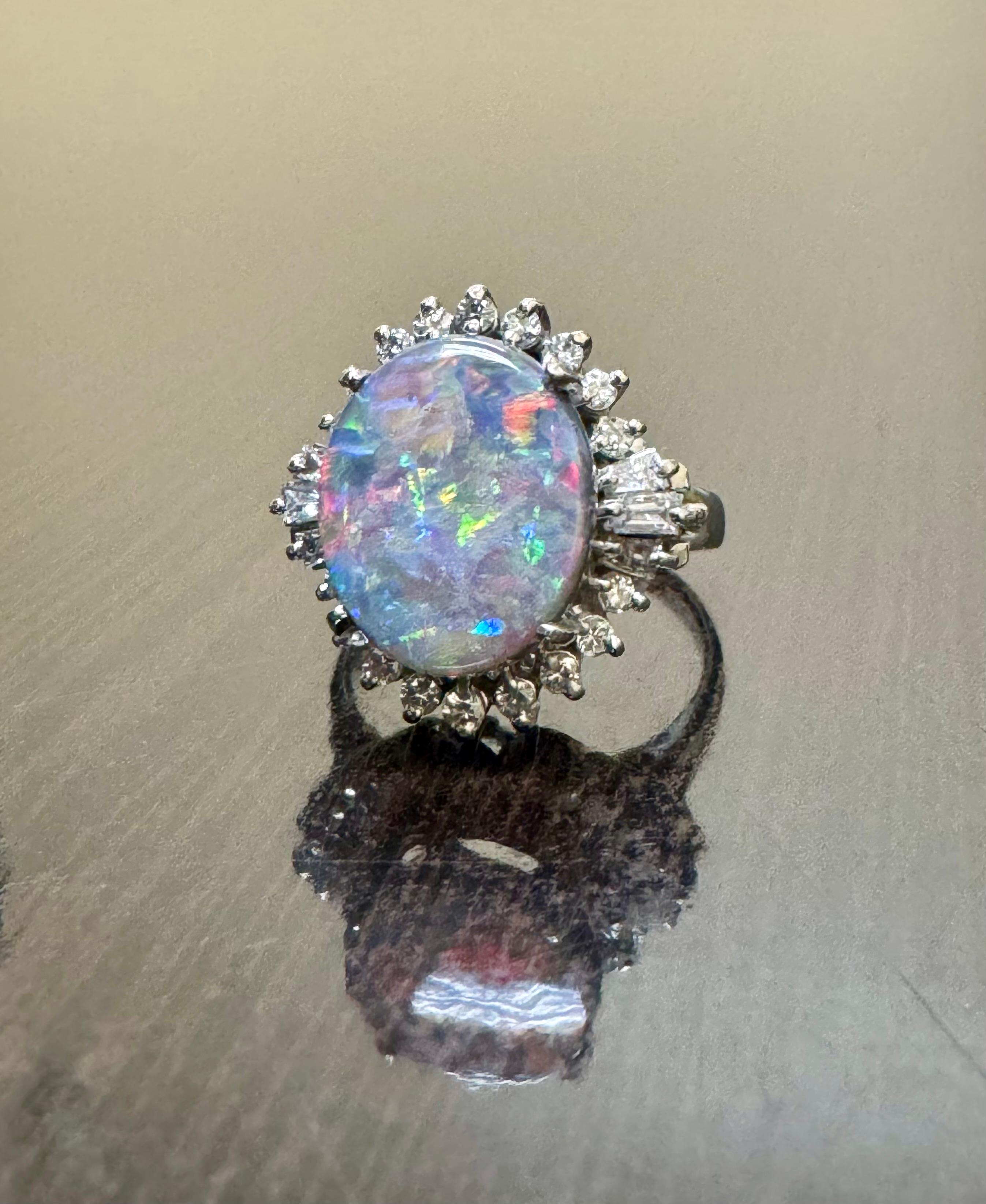 DeKara Designs Collection 

Our latest design! An entirely handmade ONE OF A KIND elegant and lustrous Australian Black Opal cabochon surrounded by beautiful baguette and round diamonds in an Art Deco inspired platinum setting.

Metal- 90% Platinum,