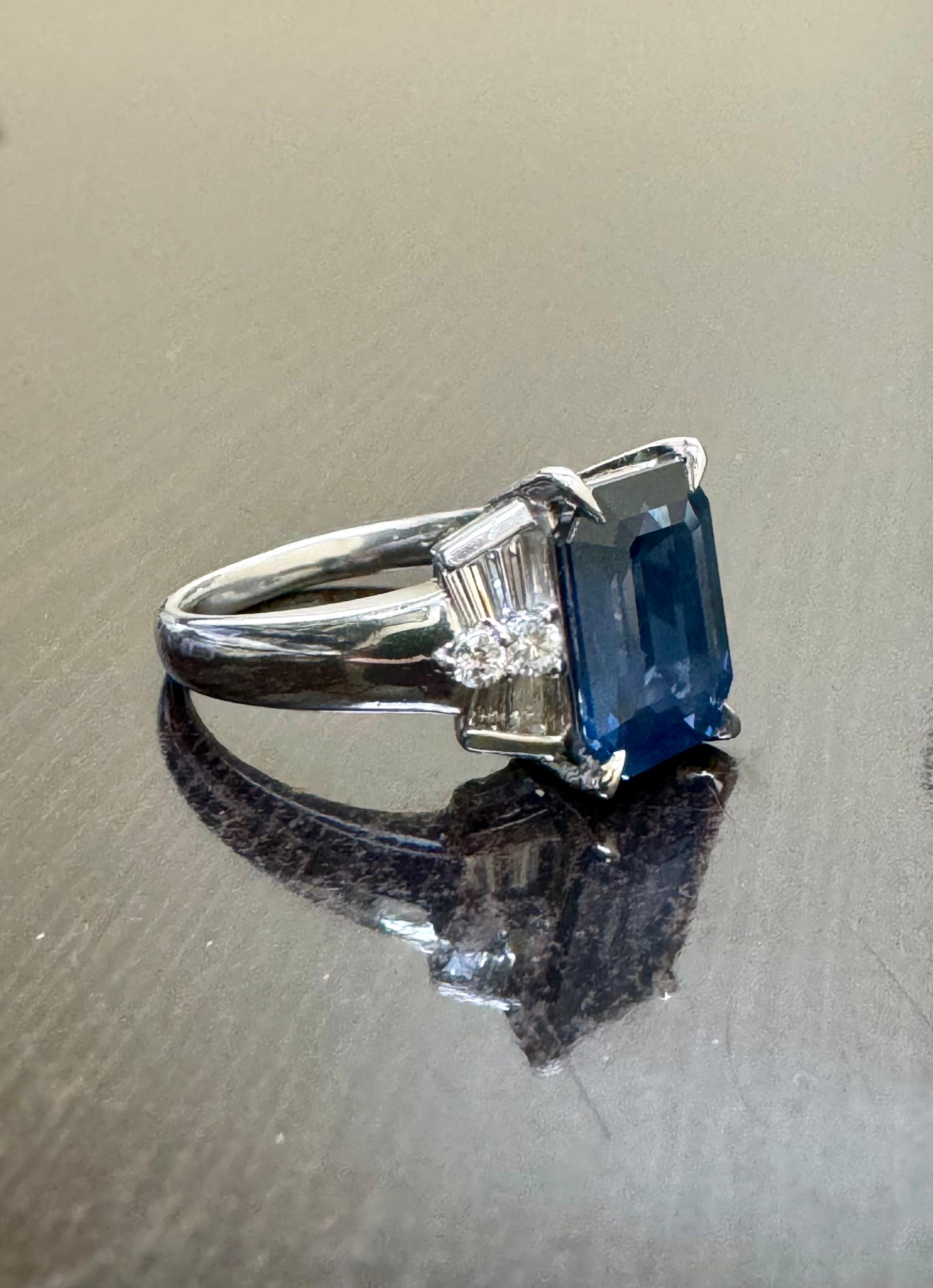 Women's Art Deco Platinum Diamond 4.26 Carat Emerald Cut Blue Sapphire Engagement Ring For Sale