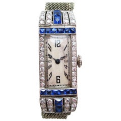 Art Deco Platinum Diamond and Calibre Sapphire Swiss Watch with 18 Karat Strap