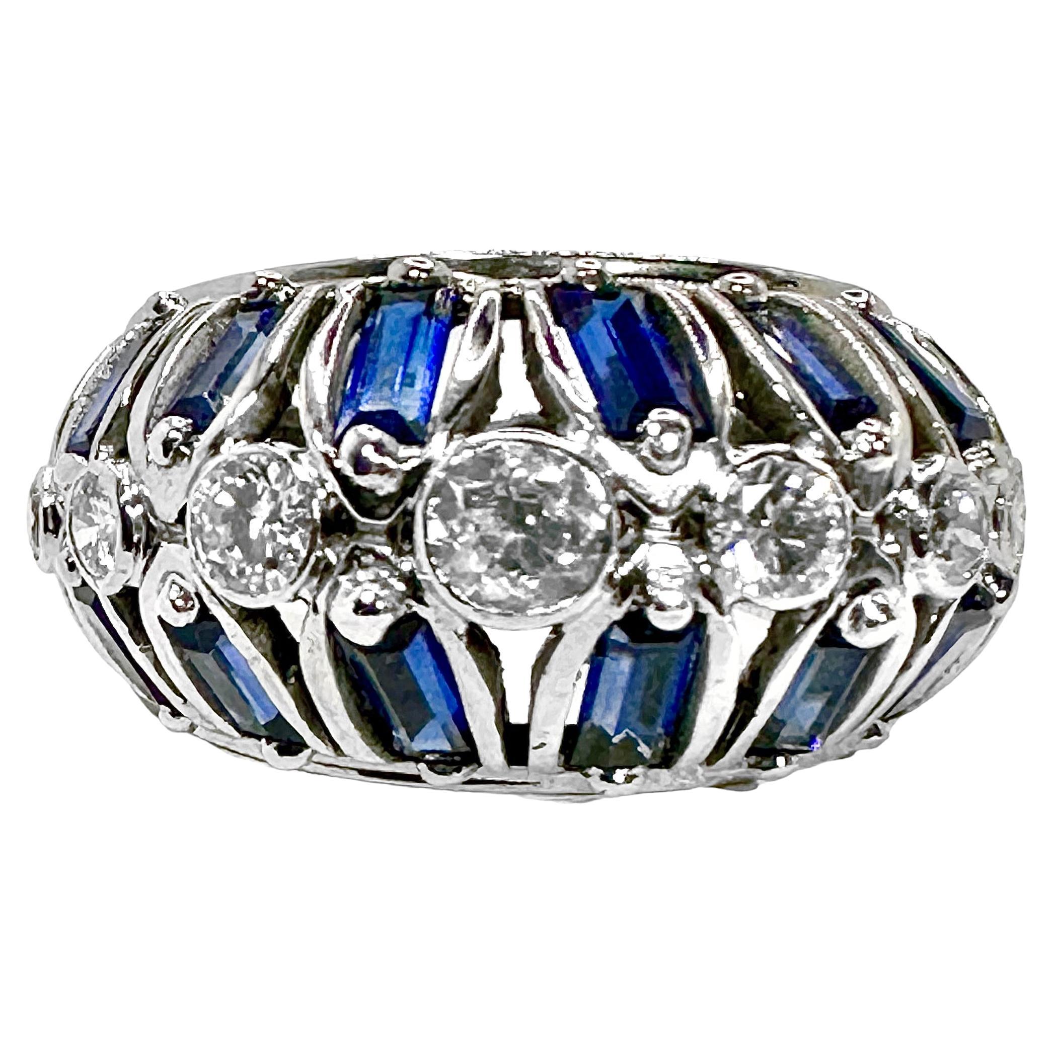This lovely and uniquely designed handmade platinum Art-Deco bombe dome ring is bezel set with seven European cut and Transitional cut diamonds, having a total approximate weight of .75ct and an overall quality of G/H color and VS1-2 clarity.