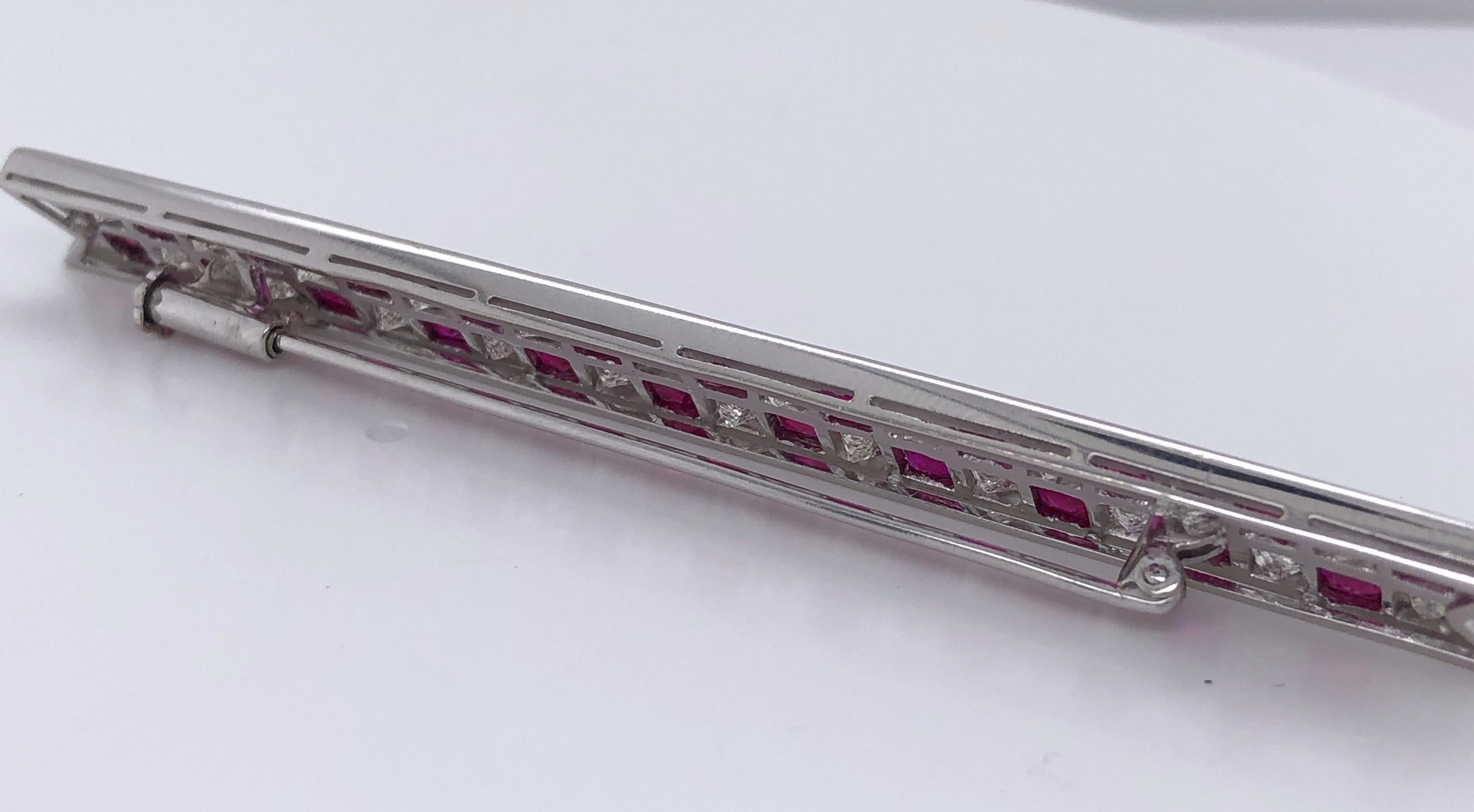 One Art Deco platinum bar set with twenty-two 3mm square rubies and twenty-two princess cut diamonds, approximately 2.25 carats total weight with matching H/I/J color and VS2/SI1 clarity. 