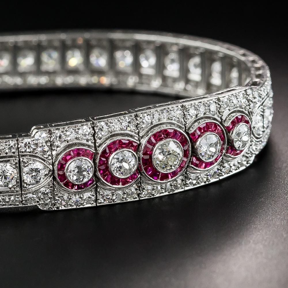 Exquisite, unique and stunning well describes this premier and pristine original Art Deco bracelet, masterfully hand fabricated in platinum at the peak of the Jazz Age - circa 1925. Centering on five overlapping (synthetic) ruby-haloed diamonds