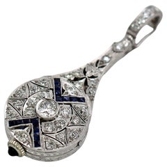 Orologio con ciondolo Lavalier in platino, diamanti e zaffiri Art Deco