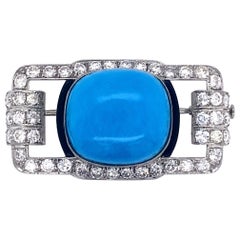 Spilla Art Deco in platino con diamanti e turchesi
