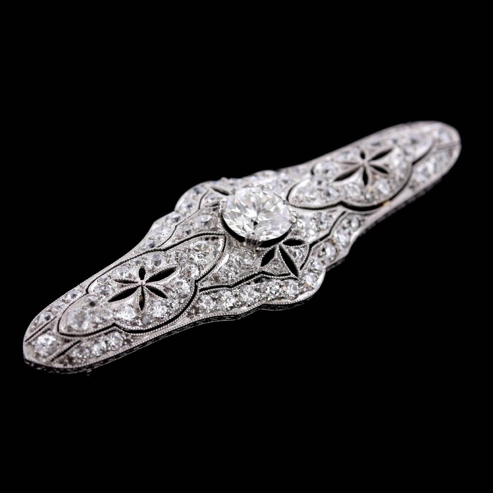 Art Deco Platinum Diamond Bar Pin. The pin is prong set with an old European cut diamond weighing approx. 1.15cts., H color, VS1 clarity, further bead set with 78 old European and old mine cut diamonds, approx. total wt. 1.70cts., HI color, VS2-SI1