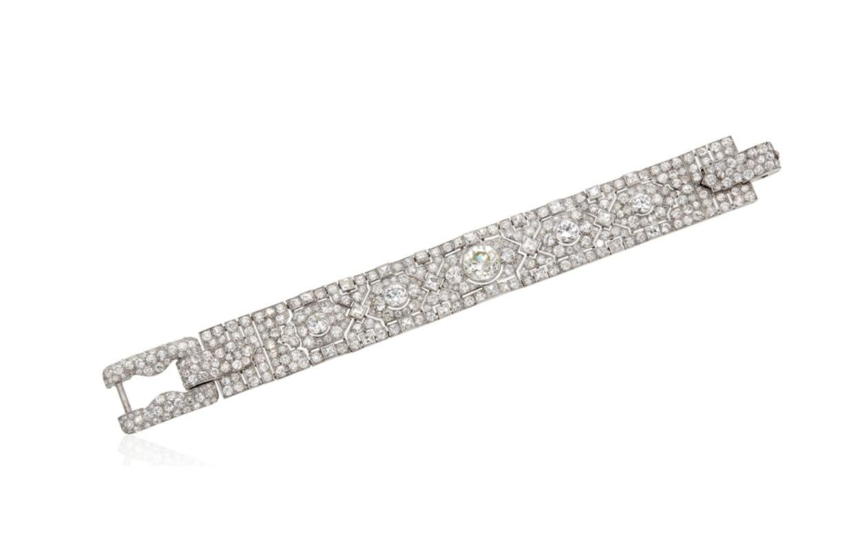 Art Deco 1920s Diamond and Platinum Strap set with1 Old European Cut Diamond approximately 3.85ct; Square Cut and Round Diamonds approximately 28ct; Although unsigned feel this bracelet is certainly made by Cartier as both the design and quality is