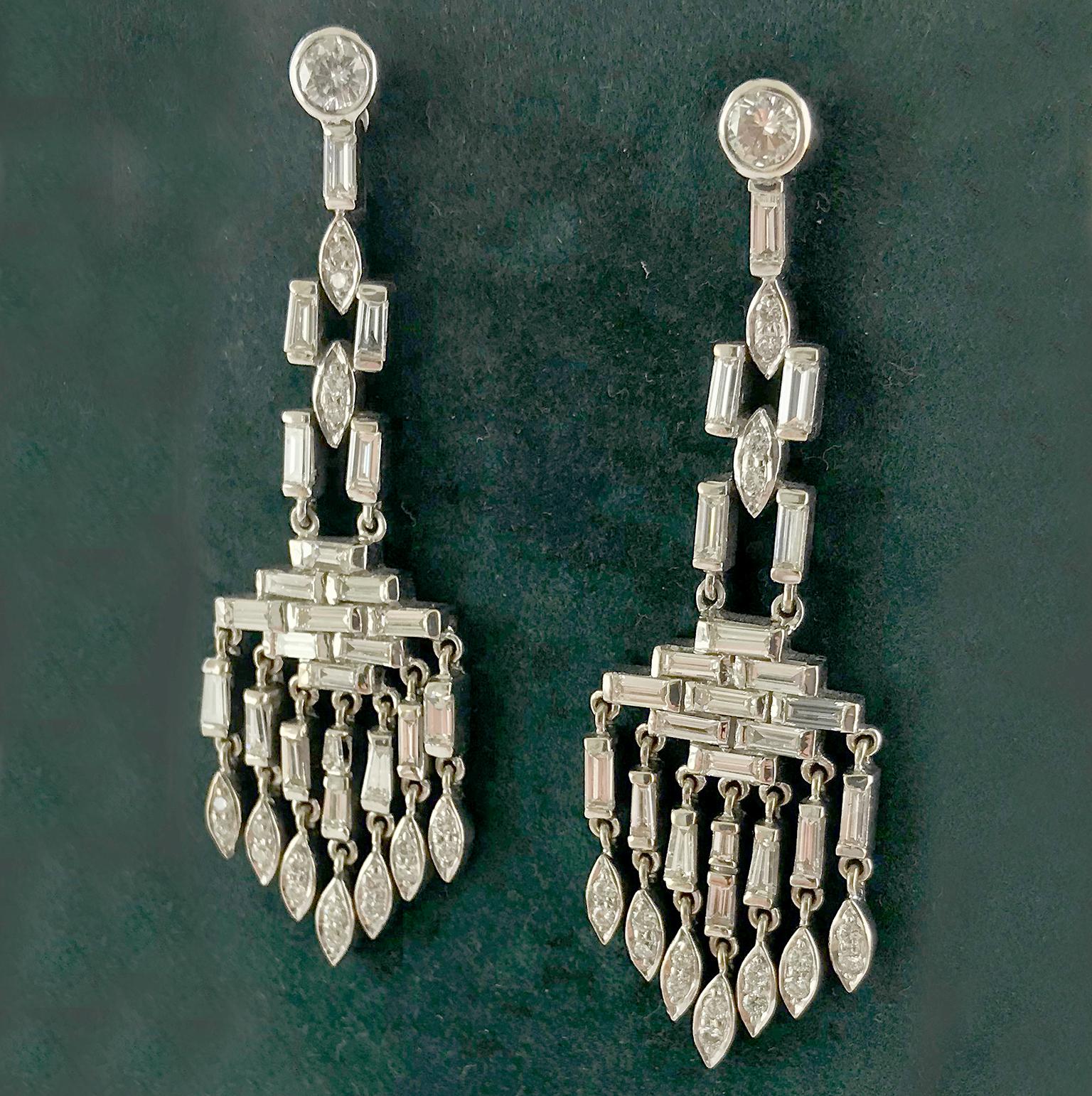 A pair of white diamond chandelier earrings from the 1930’s in the Art Deco style.

Baguette and marquise shaped white diamonds set in platinum and 18ct yellow gold in a tasselled chandelier design.

Total Diamond weight (approx.) 5.70cts, F/G/H