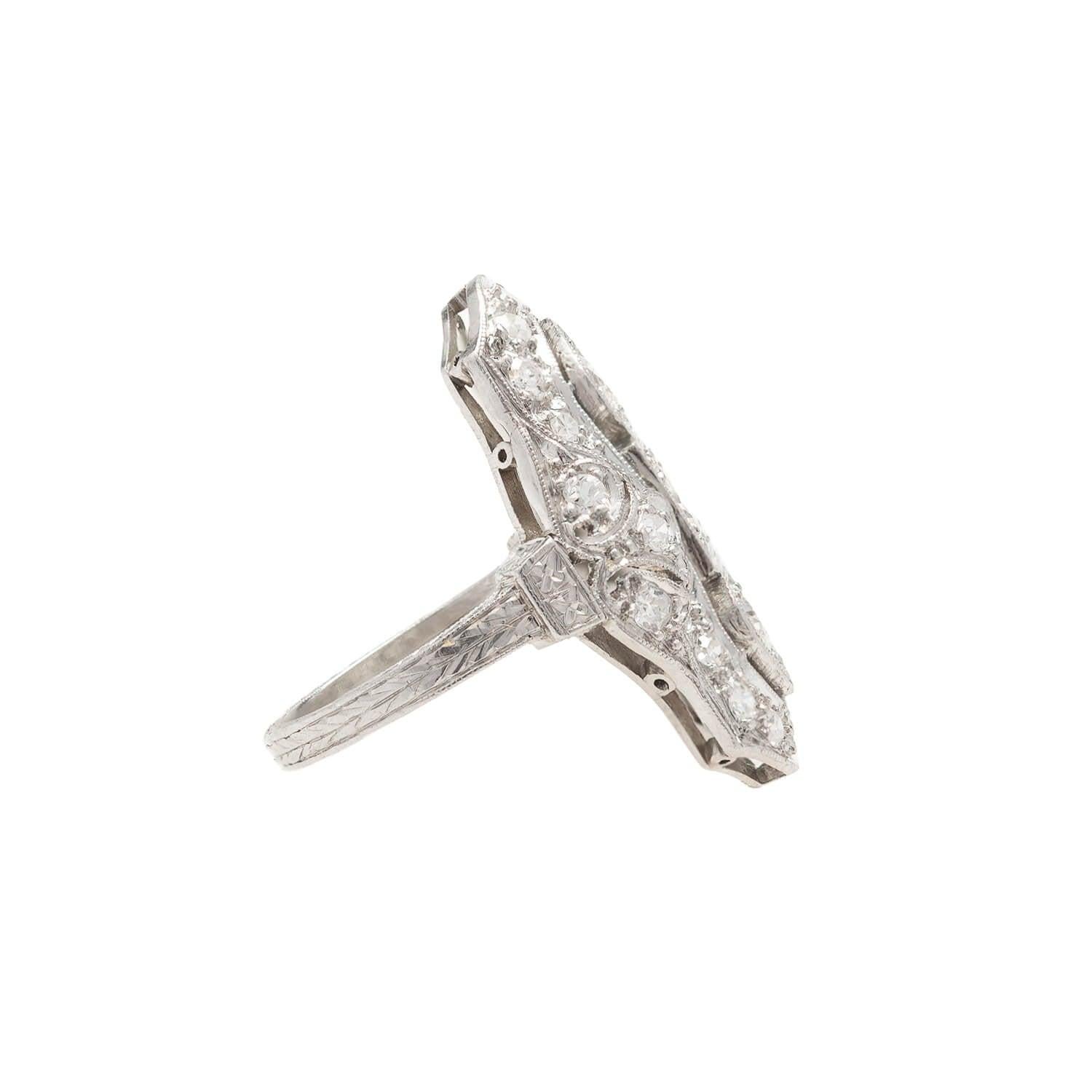 A fantastic diamond ring from the Art Deco (ca1920s) era! Made of platinum, the ring has a stylish and bold navette design decorated with exquisite sparkling Old European cut diamonds. The platinum setting features elegant scrolling filigree and