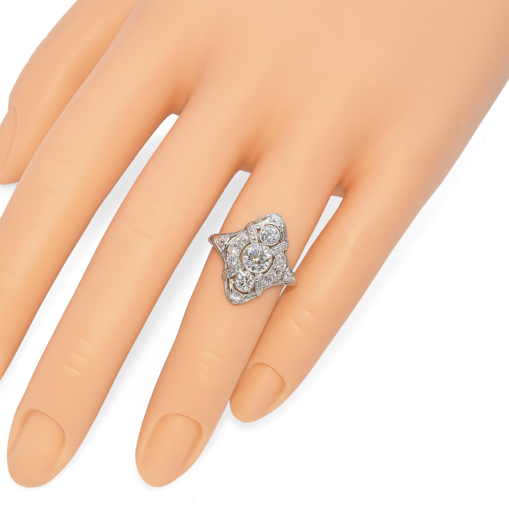A dazzling array of brilliant-cut diamonds is meticulously set within an intricate openwork design in this exquisite ring. The central diamond is flanked by smaller stones, creating a harmonious balance of sparkle and elegance.

Weight: 5 grams