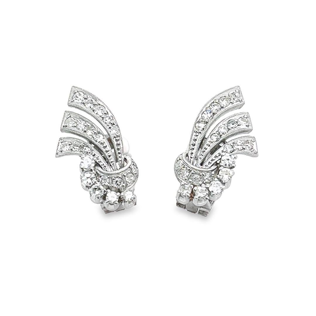 A pair of timeless earrings that is anything but ordinary, this art deco pair of diamond earrings is a creative take on vintage jewelry. It is composed of 42 diamonds, totaling 1.30 carats, that are hand-set in a fan-like fashion in a platinum