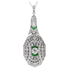 Colgante relicario Art Déco de diamantes y esmeraldas en platino