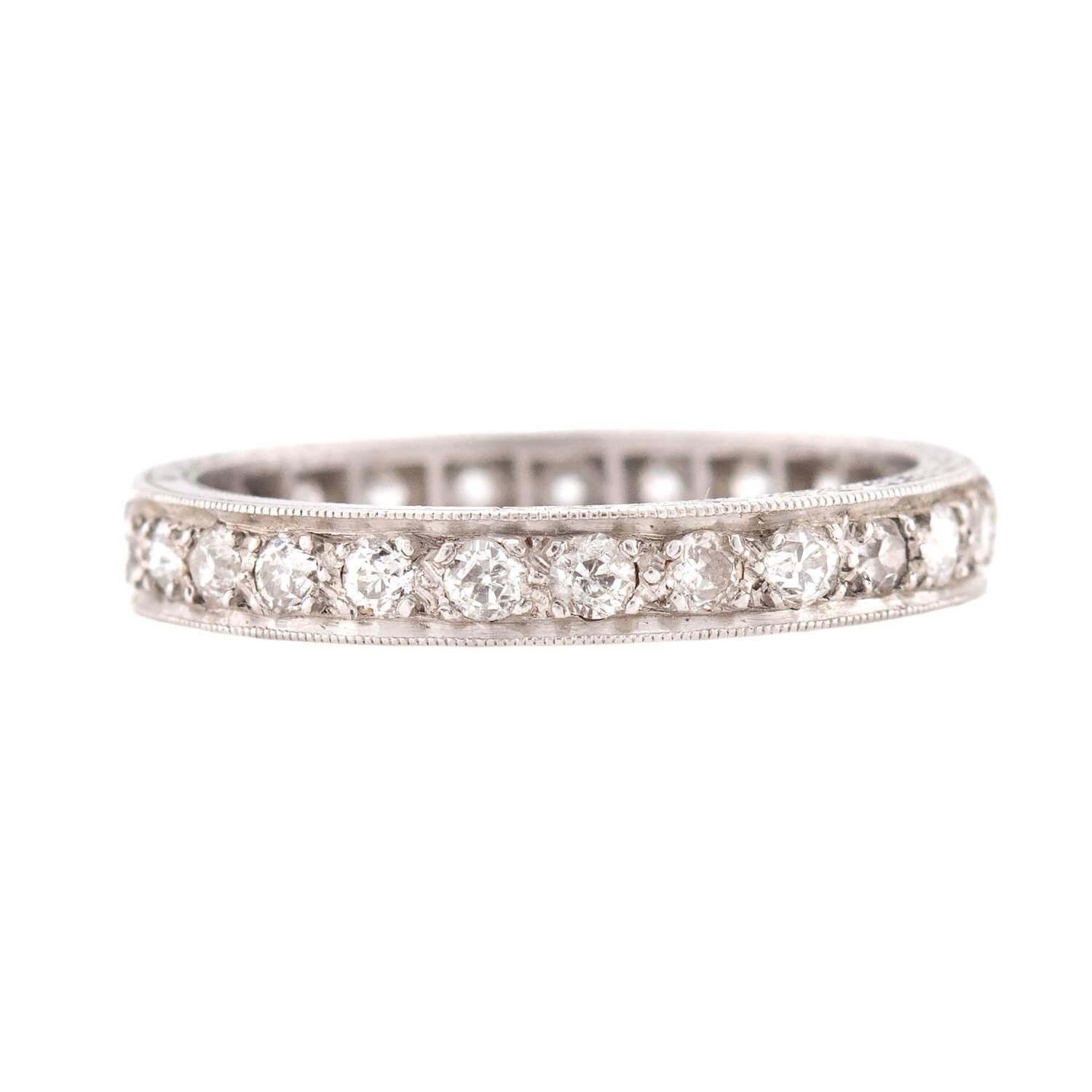 A gorgeous diamond eternity band from the Art Deco (ca1920s) era! Crafted in platinum, this ring features 1ctw of bead-set old mine cut diamonds. The stones, which carry the entire way around the band, display H/I color and VS1-SI1 clarity. The top