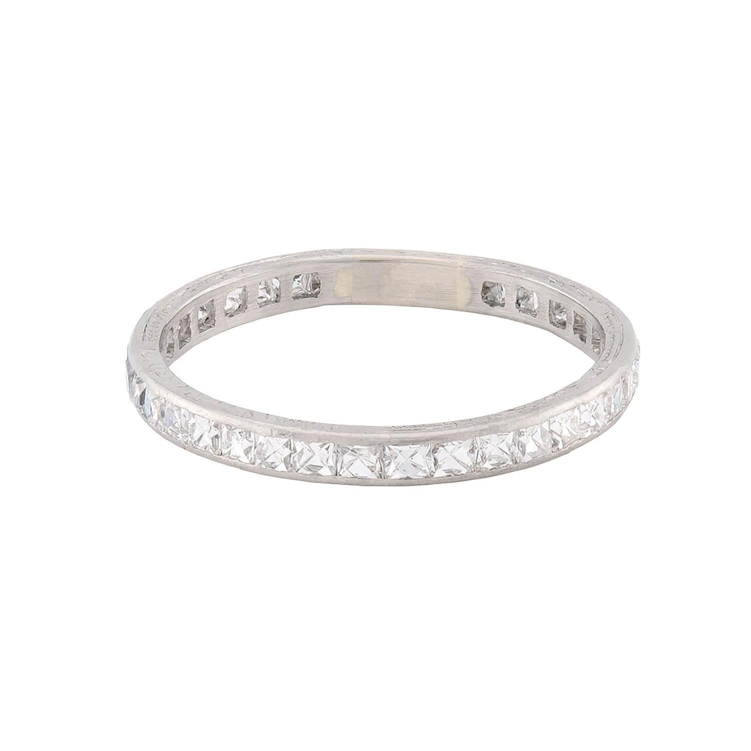 A gorgeous eternity band from the Art Deco (ca1920s) era! Crafted in platinum, this ring features a single row of channel-set French cut diamonds. Overall, the diamond have a total carat weight of 1.35ctw. The top and bottom edge of the ring feature