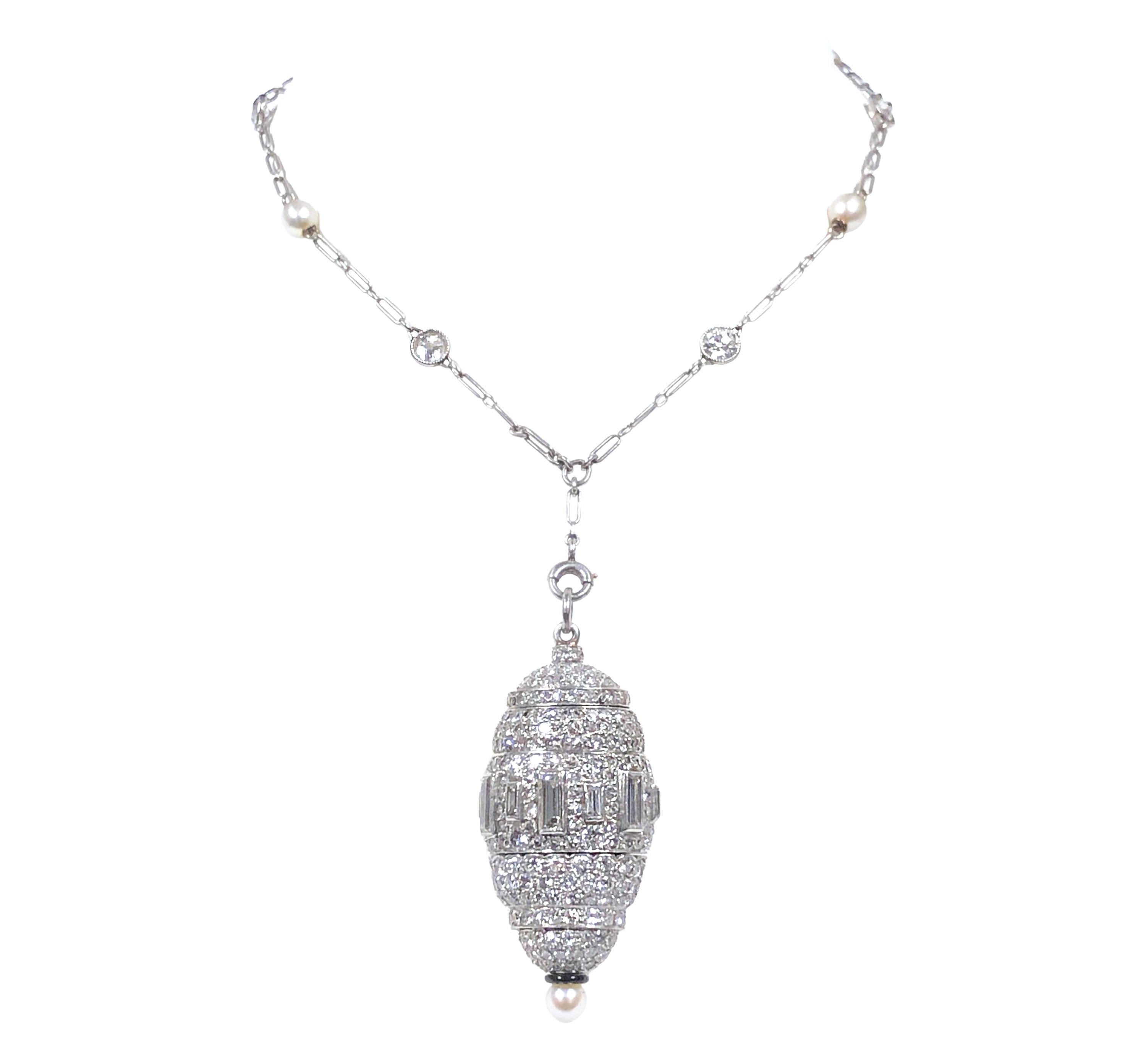 Circa 1920s incredible Art Deco Platinum Watch Pendant Necklace, This is of very fine quality and outstanding artisan workmanship comparable to Cartier, LaCloche Etc. the concealed, hidden watch is on a spring loaded mechanism that slides in and out