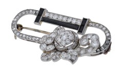 Art Deco Platinum, Diamond, Onyx and Diamond Stylized Brooch
