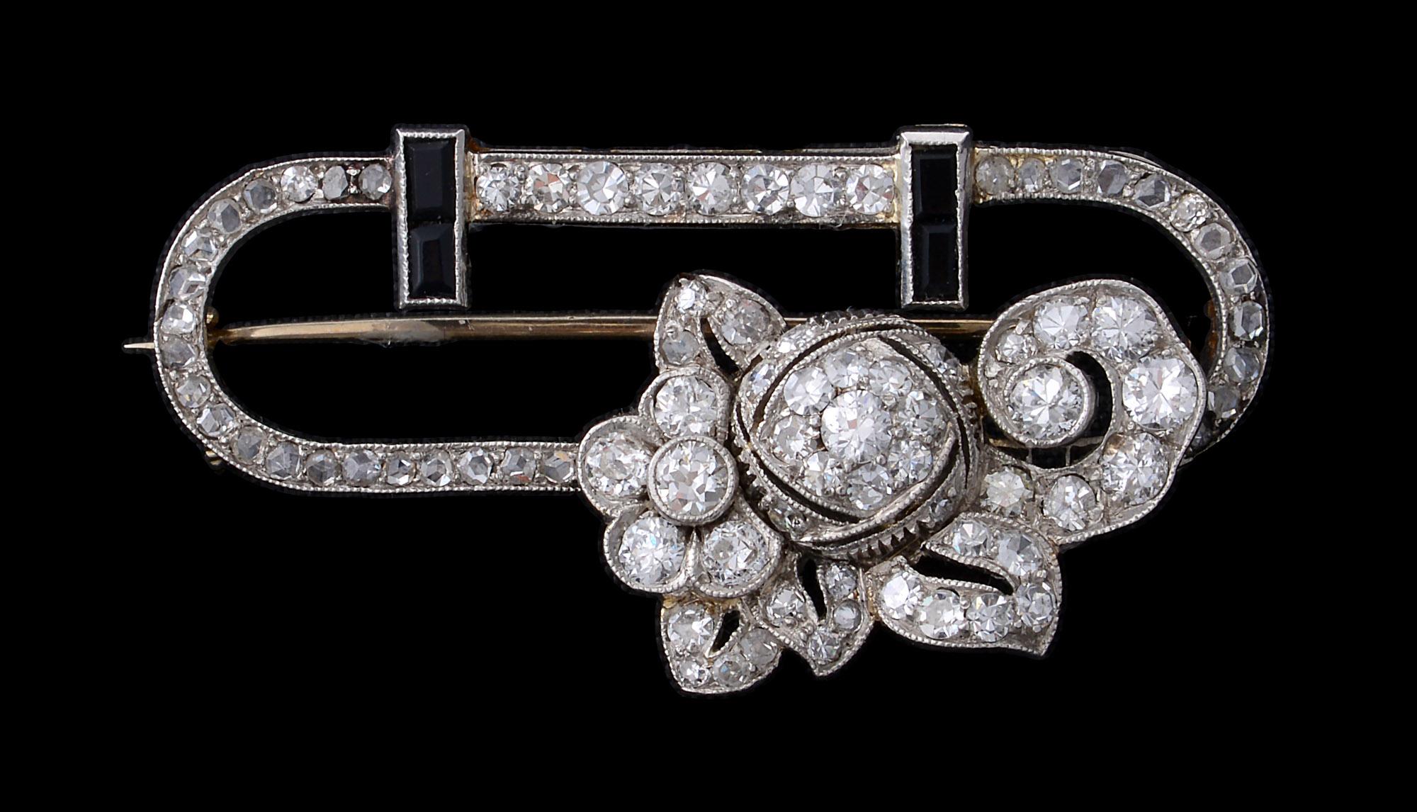 Women's Art Deco Platinum, Diamond, Onyx and Diamond Stylized Brooch For Sale