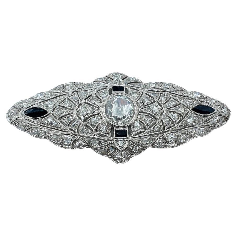 Art Deco Brosche aus Platin, Diamanten und Onyx