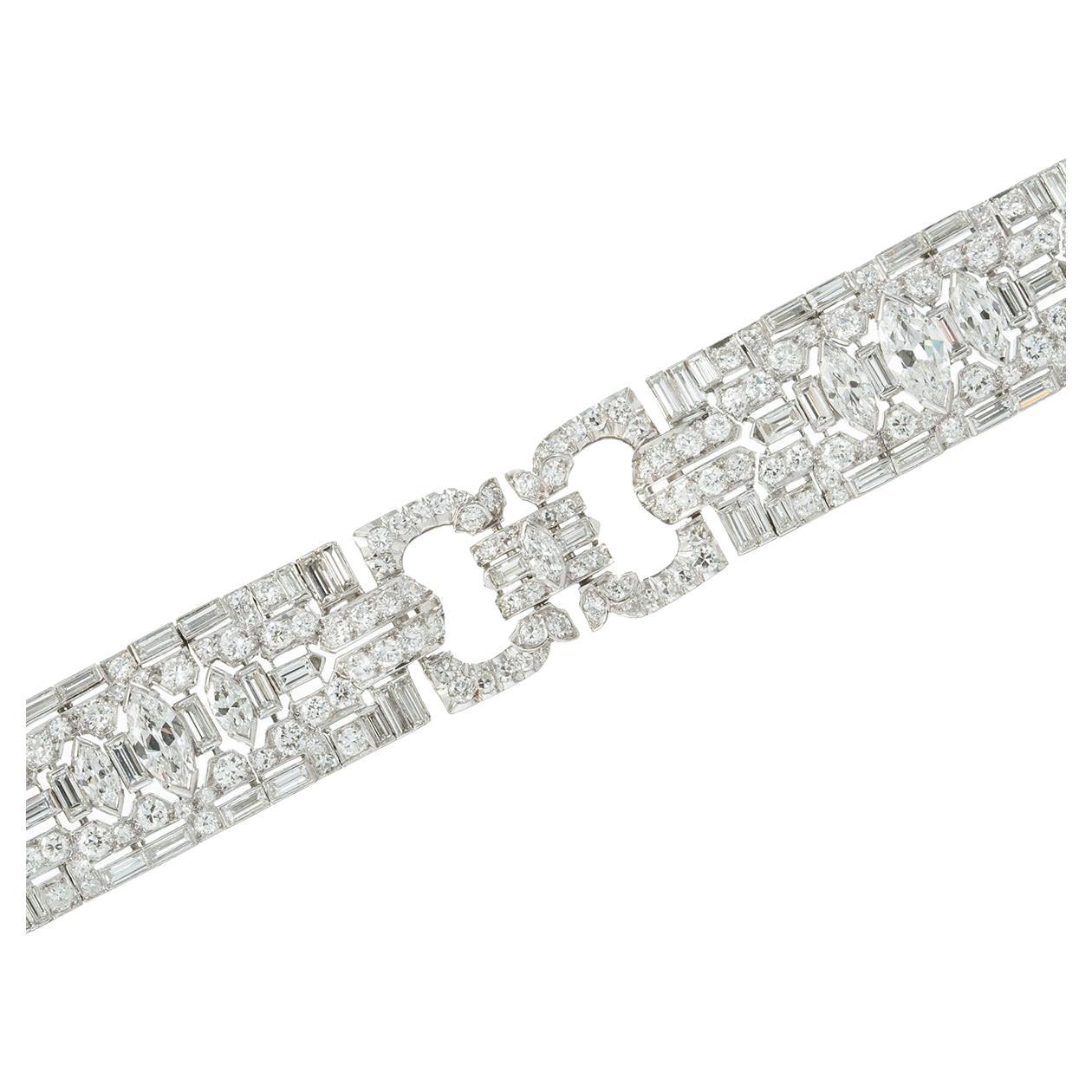 Very fine Art Deco diamond panel link bracelet, set with marquise-shaped, baguette-cut and circular-cut diamonds.  Handmade in platinum.  Diamonds weighing approximately 7.50 total carats (the three largest central marquise-shaped diamonds weighing
