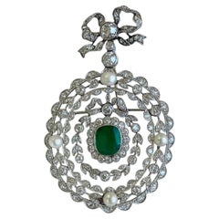 Art Deco Platinum, Diamond, Pearl, and Emerald Bow Brooch Art Deco Platinum, Diamond, Pearl, and Emerald Bow Brooch