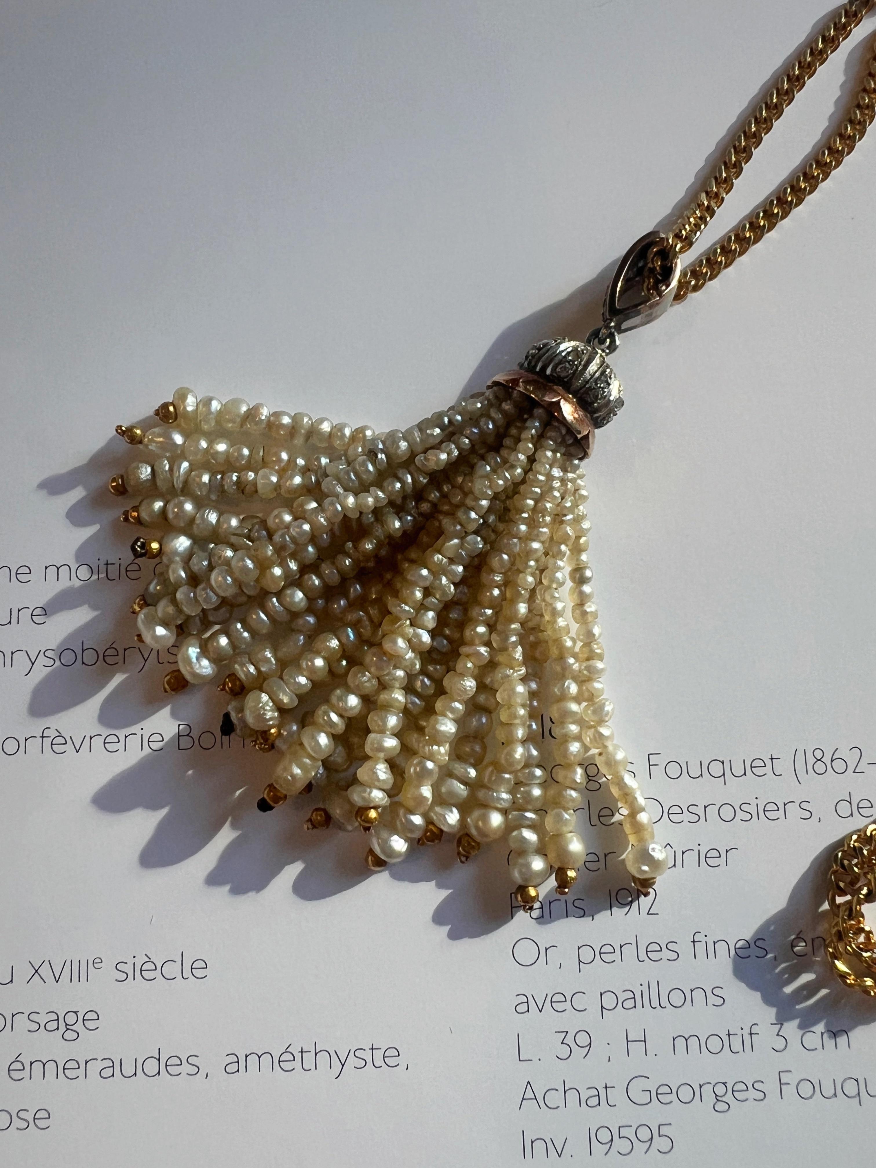For sale a beautiful Art Deco era tassel pendant featuring 23 strings of white natural pearl beads, above which sits the rose cut diamond-encrusted motif. Evoking the glamour and glitz of the 1920s, this very chic one-of-a-kind tassel is the