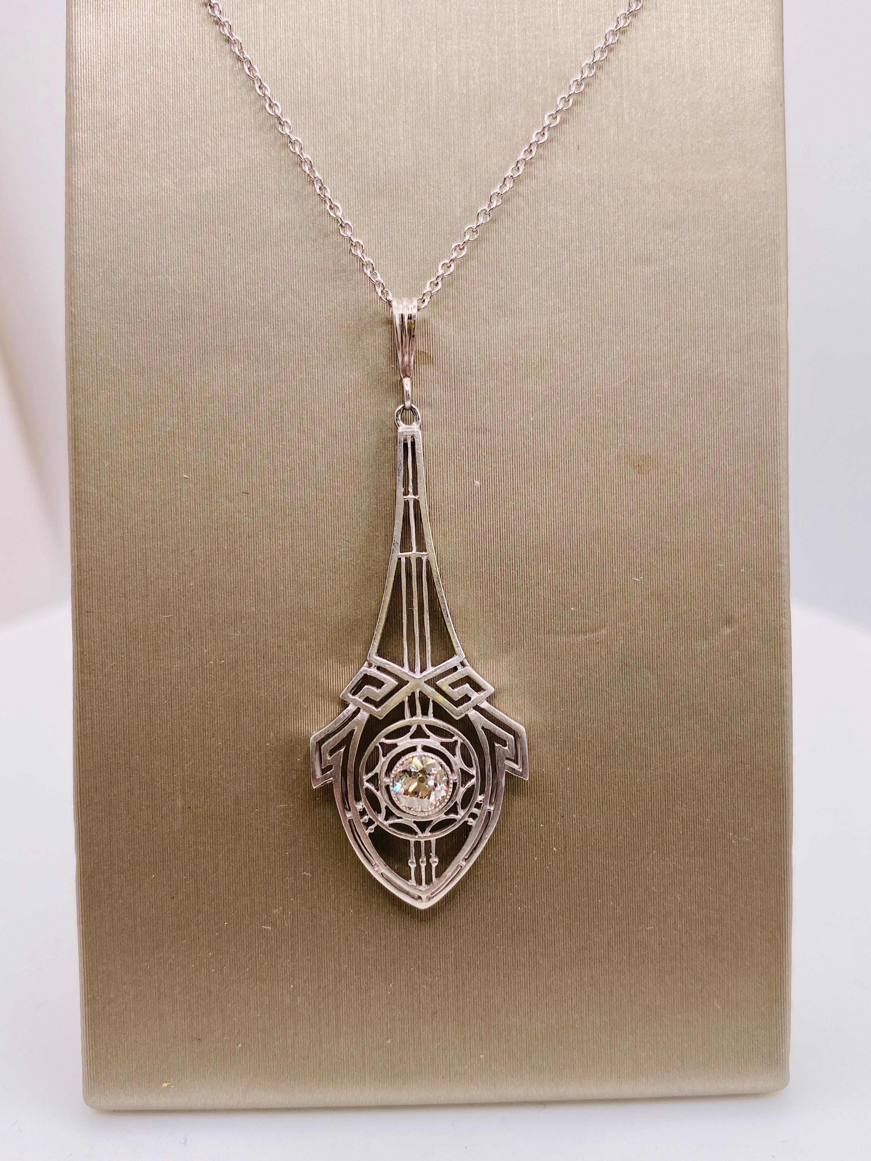 Art Deco circa 1925 platinum pendant with approximately .23 carat old euro cut diamond. Includes 14k white gold chain.