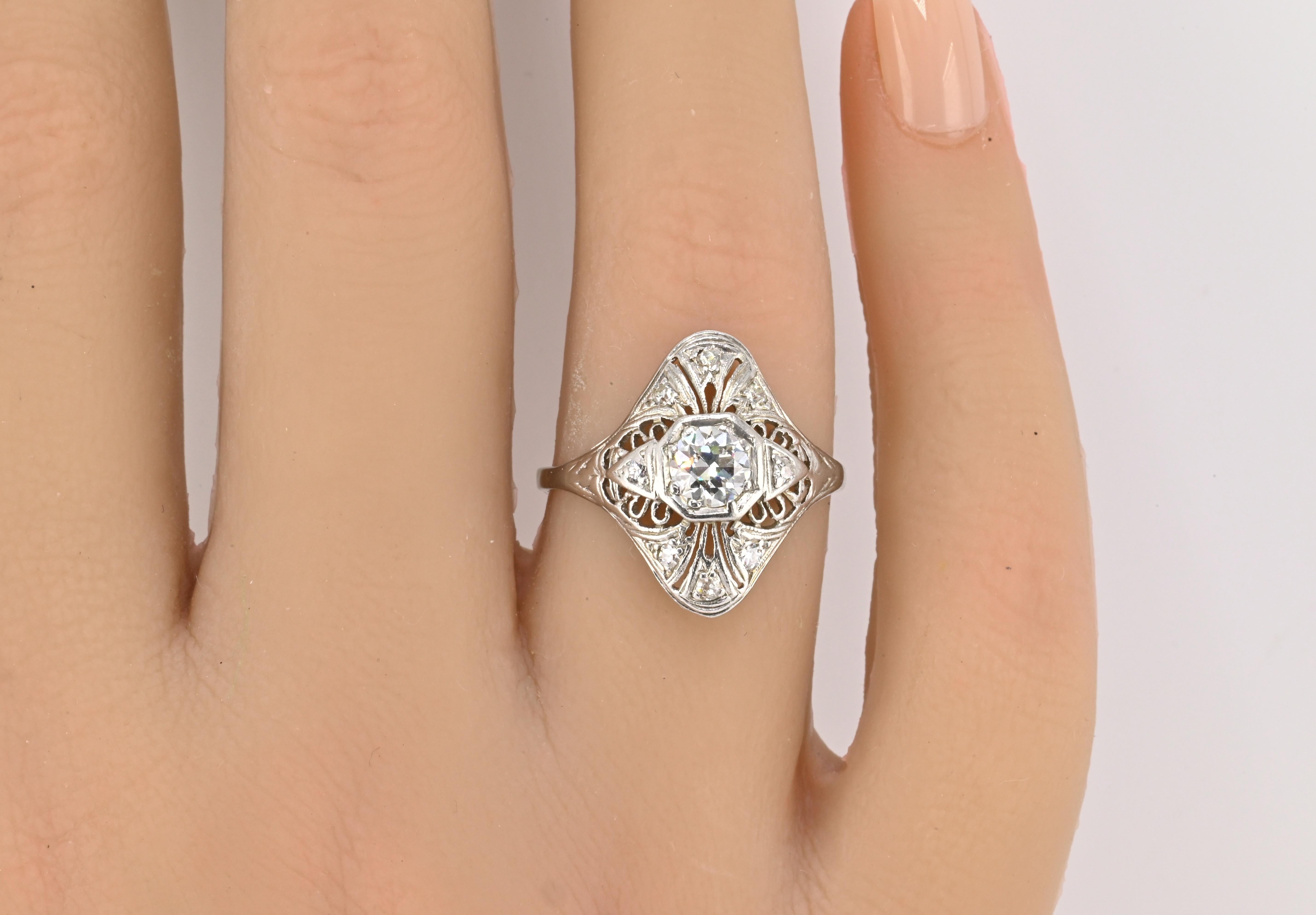 Art Deco Platinum Diamond Ring – 0.62ct Total, 9 Natural Diamonds, SI Clarity, Size 8.75, 1.90 dwt

Description:
This elegant Art Deco platinum ring captures the timeless beauty and geometric symmetry of the 1920s–1930s. Crafted in solid platinum