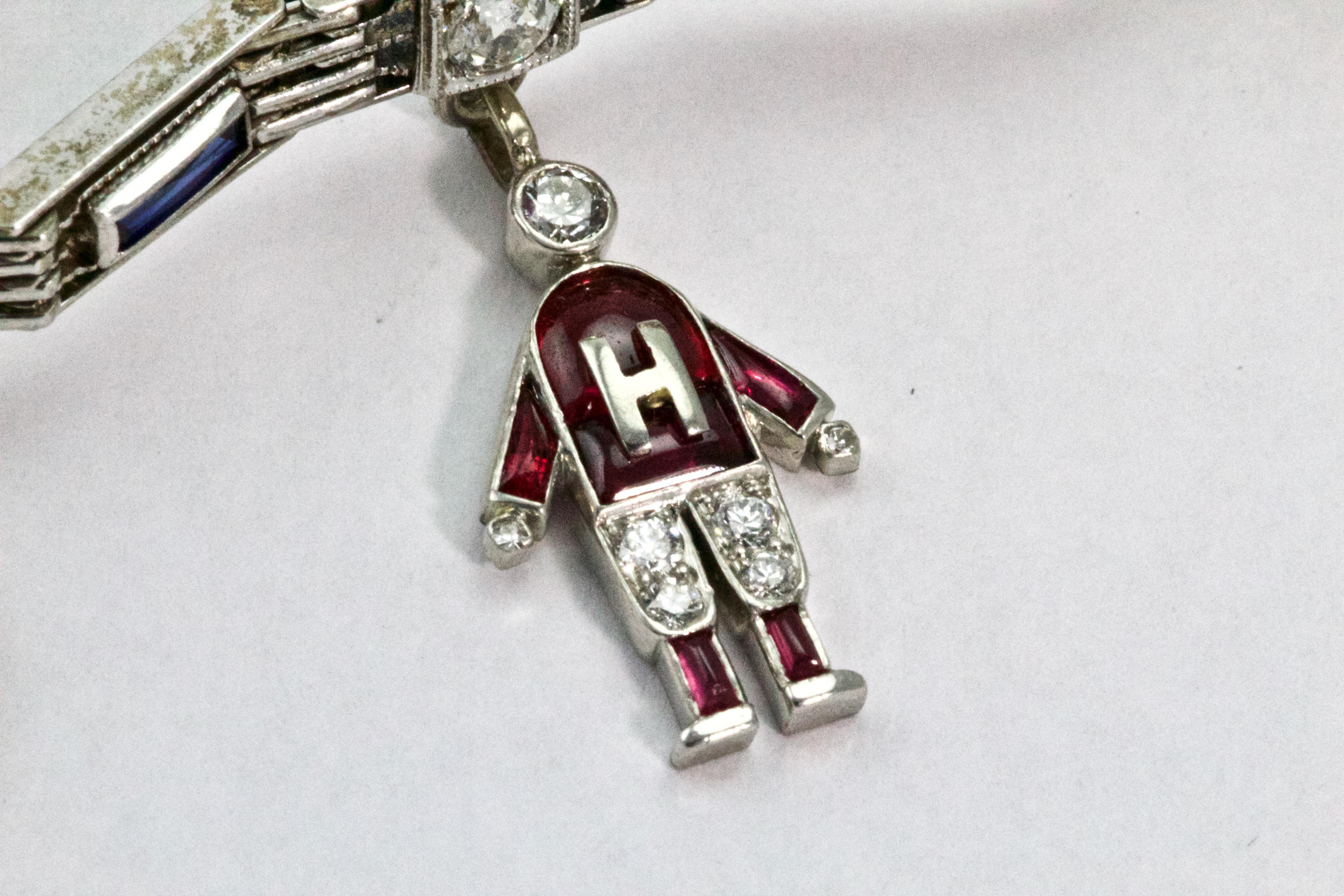 Art Deco Platinum Diamond Ruby Sapphire Opal Charm Bracelet In Excellent Condition In Chipping Campden, GB
