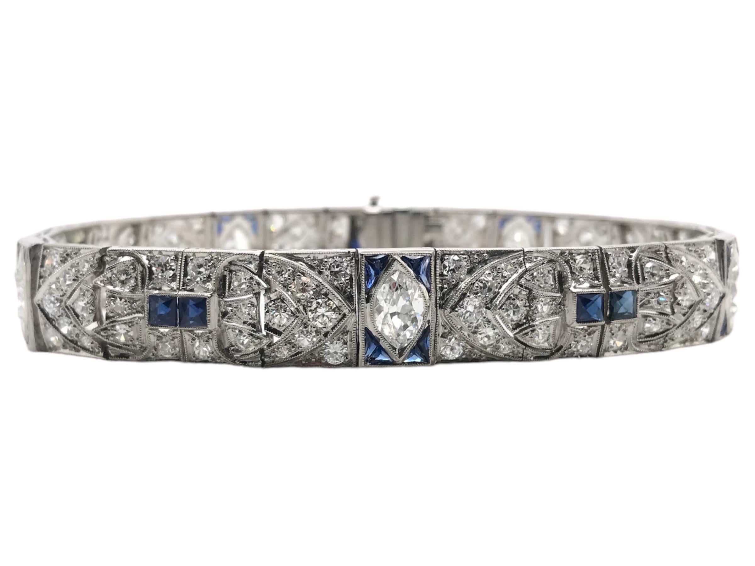 Absolutely Stunning!!
This lovely Art Deco, 1920 - 1940, Bracelet is stunning!! 
Completely detailed with multiple cuts of diamonds & sapphires.
Bracelet Length: 7 Inches
Weight: 28.9 Grams

Diamond Details:
5 - Old Marquise Cut Diamonds; FG Color;